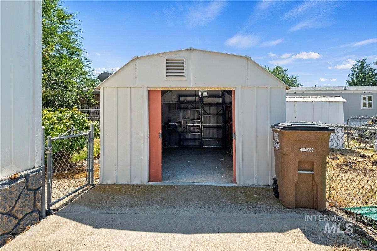View of shed with a gate