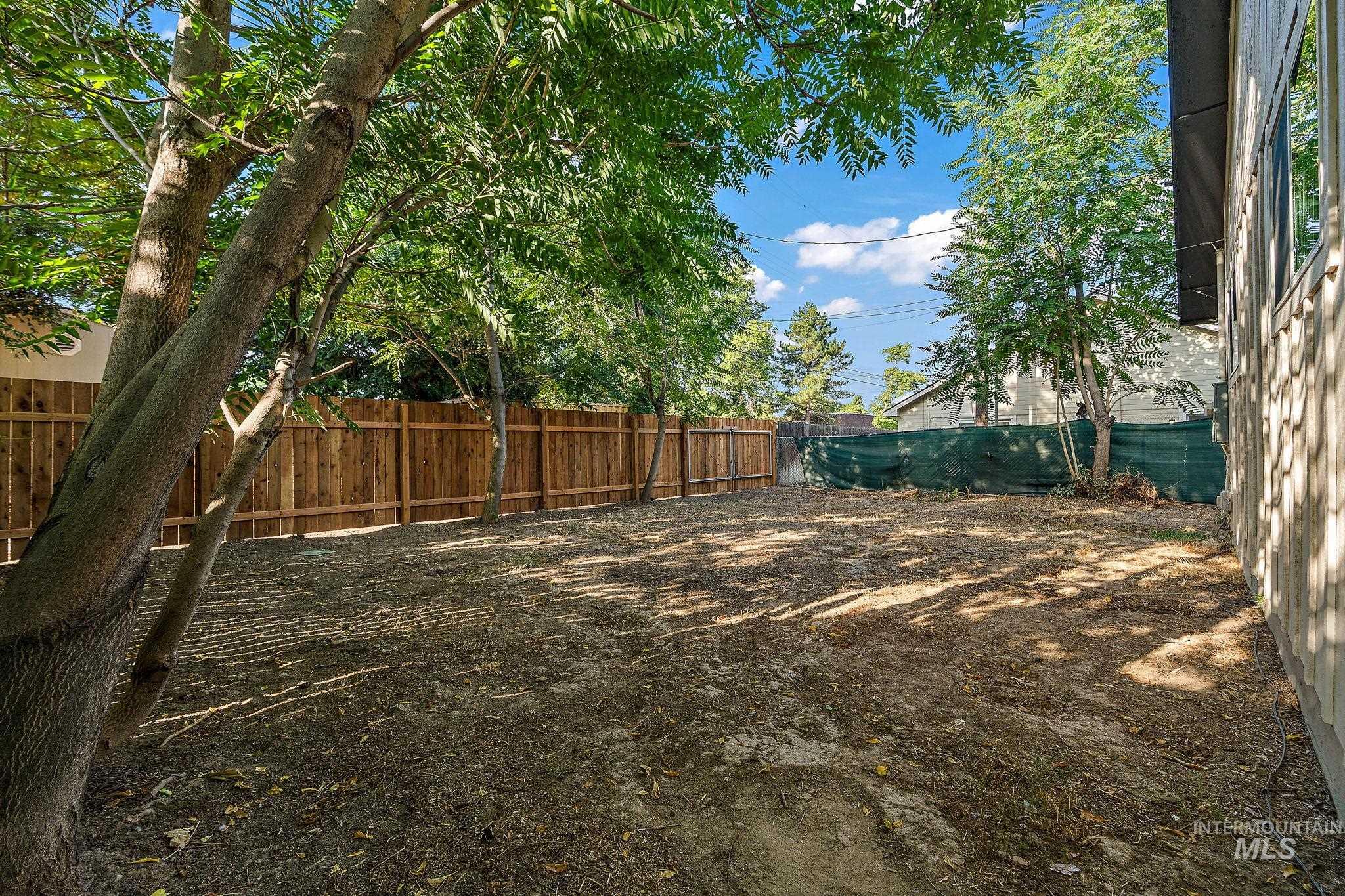 View of fenced backyard