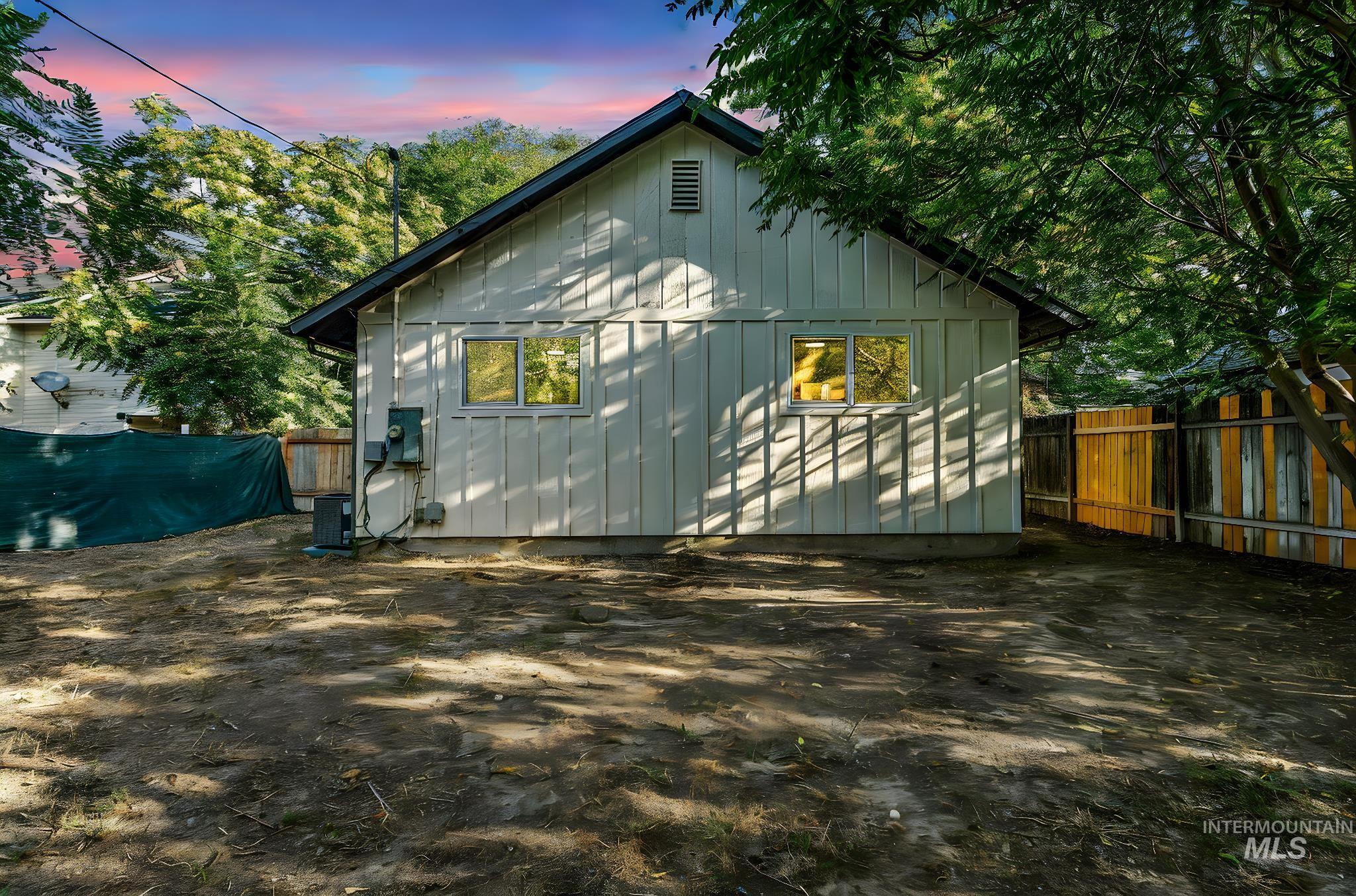 Rear view of property featuring board and batten siding