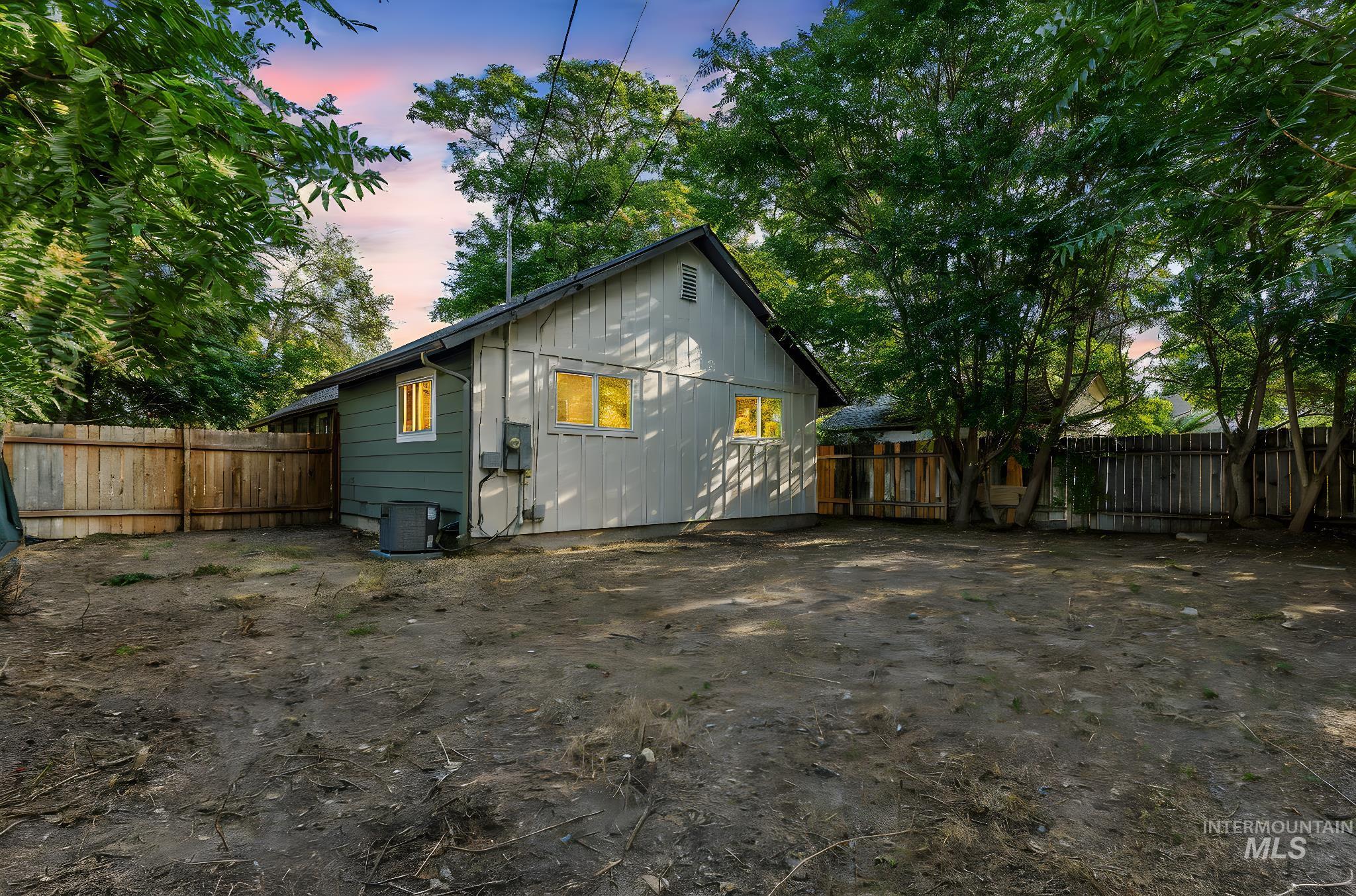 View of property exterior with a fenced backyard