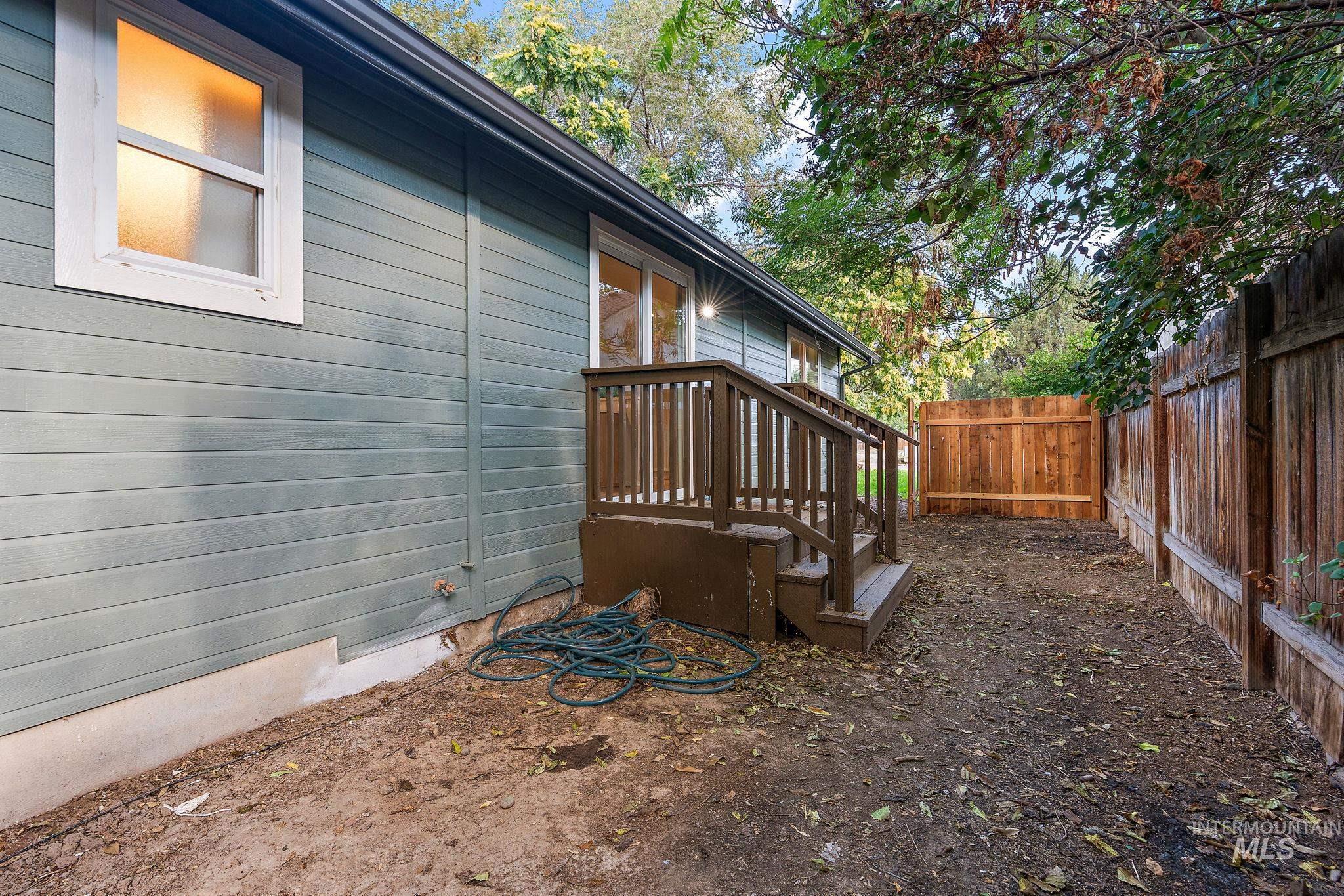View of side of property with a fenced backyard