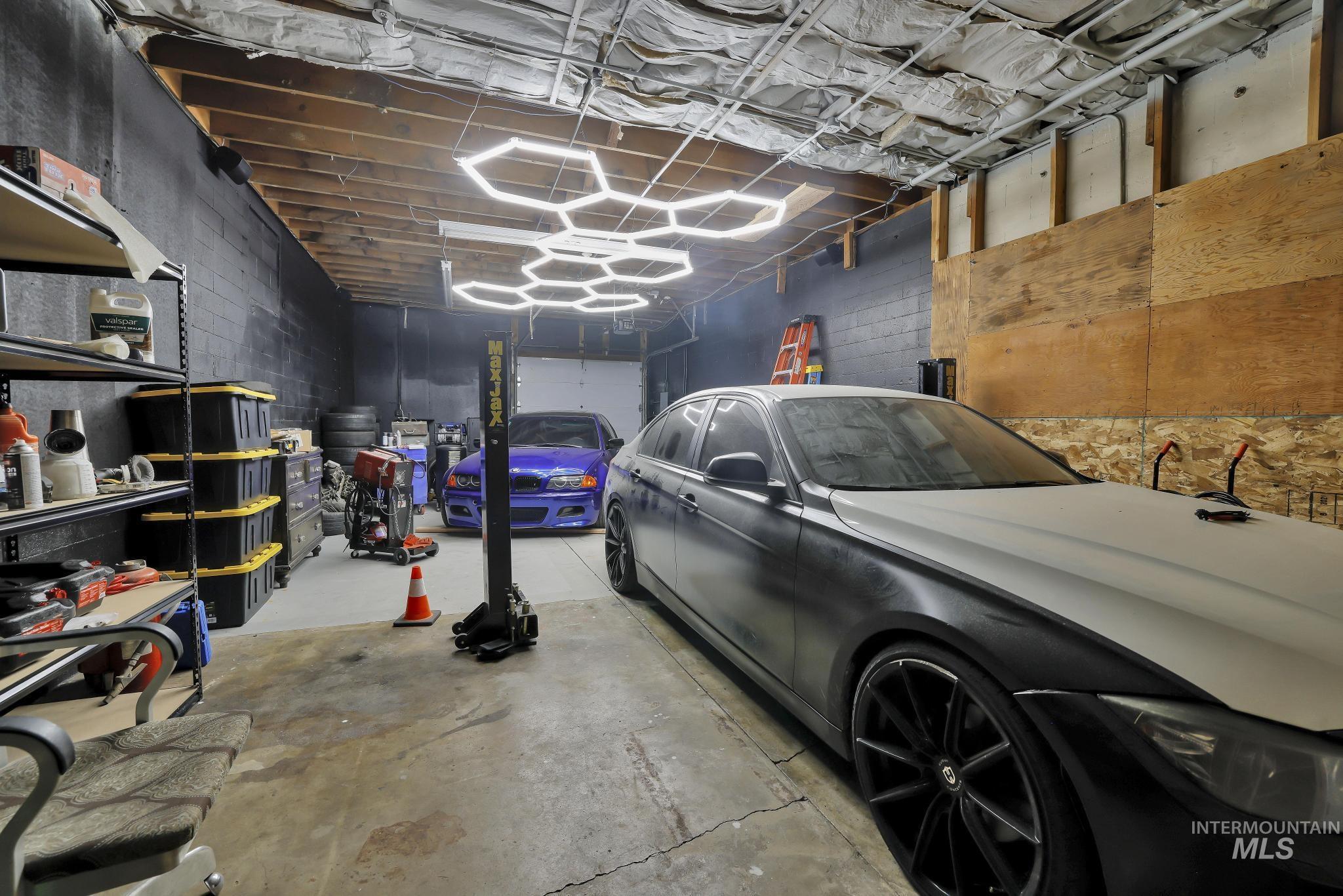Garage featuring concrete block wall
