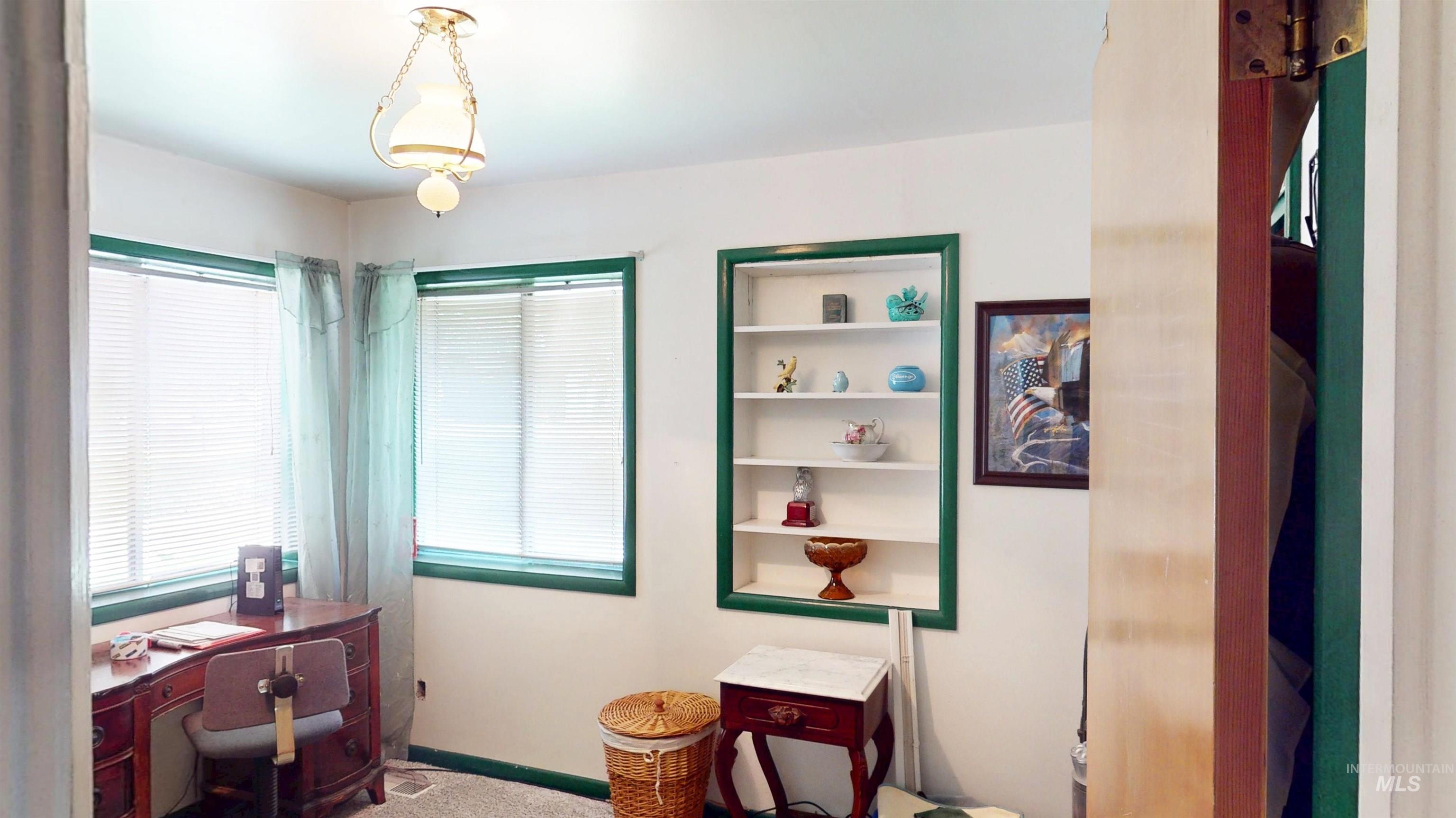 Office featuring carpet and baseboards