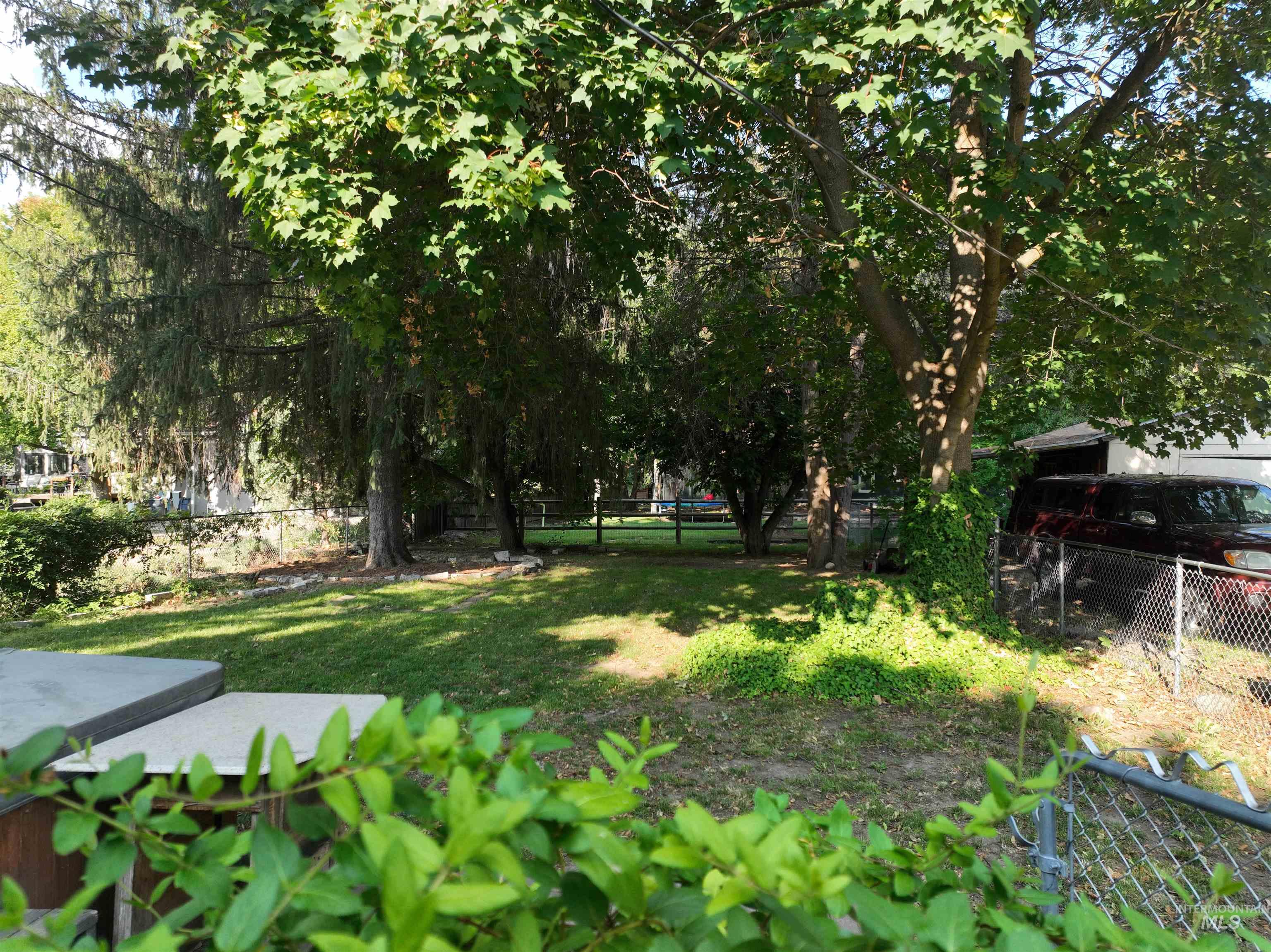 View of fenced backyard