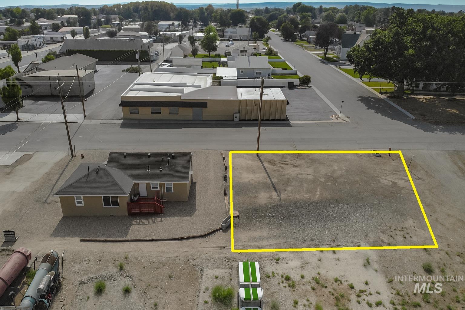 Aerial perspective of suburban area featuring property parcel outlined
