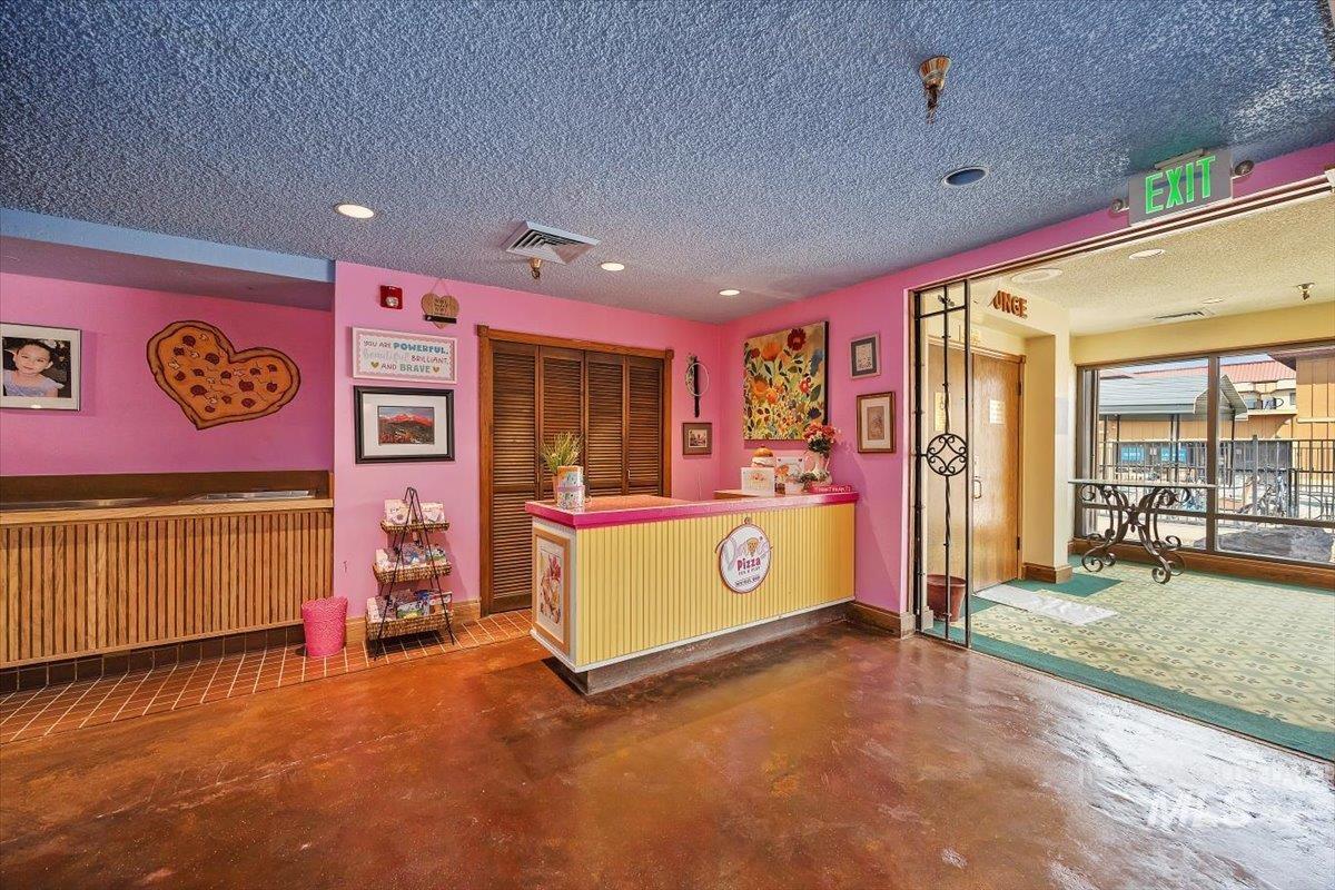 Reception area featuring a textured ceiling and recessed lighting