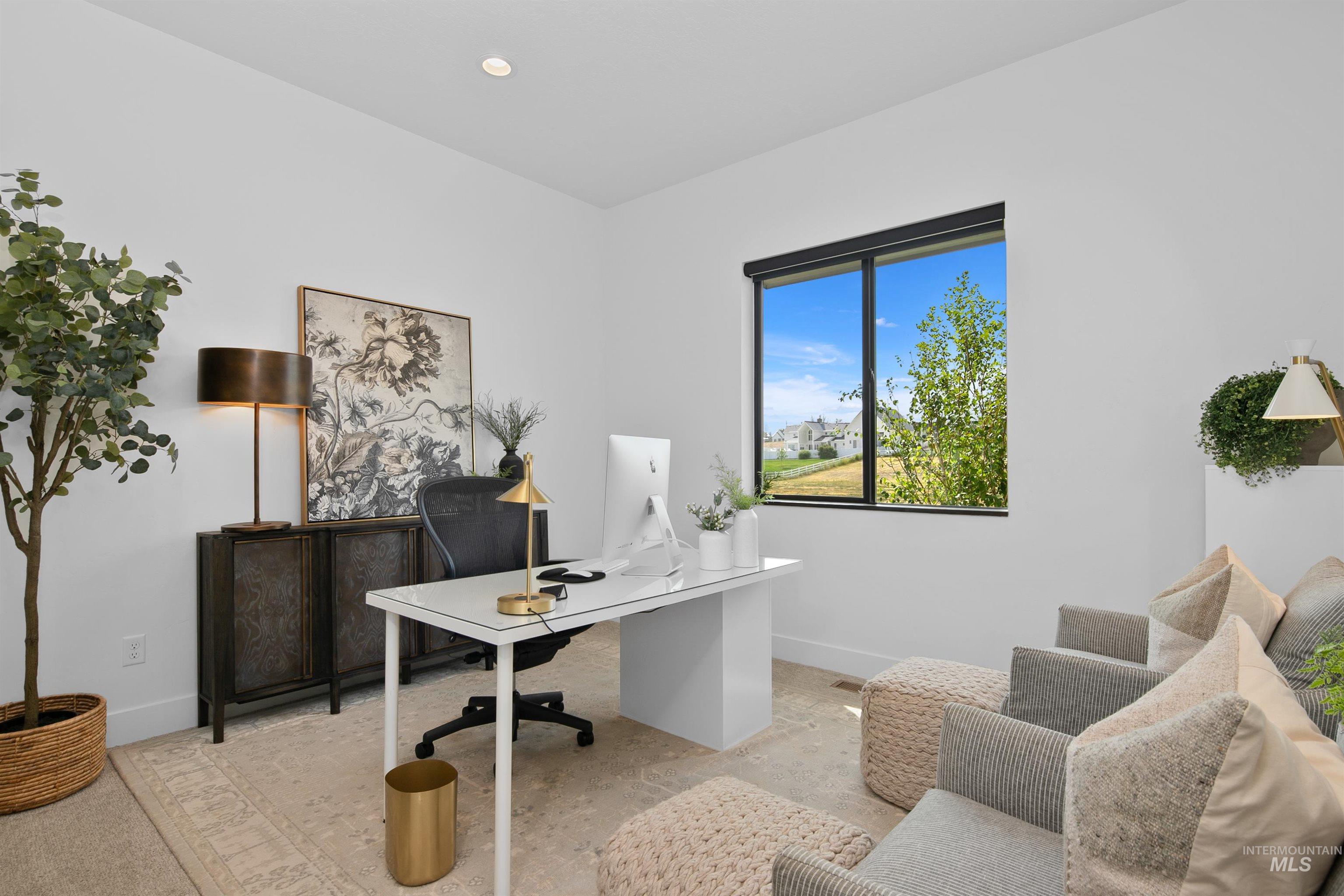 Office area with baseboards and recessed lighting