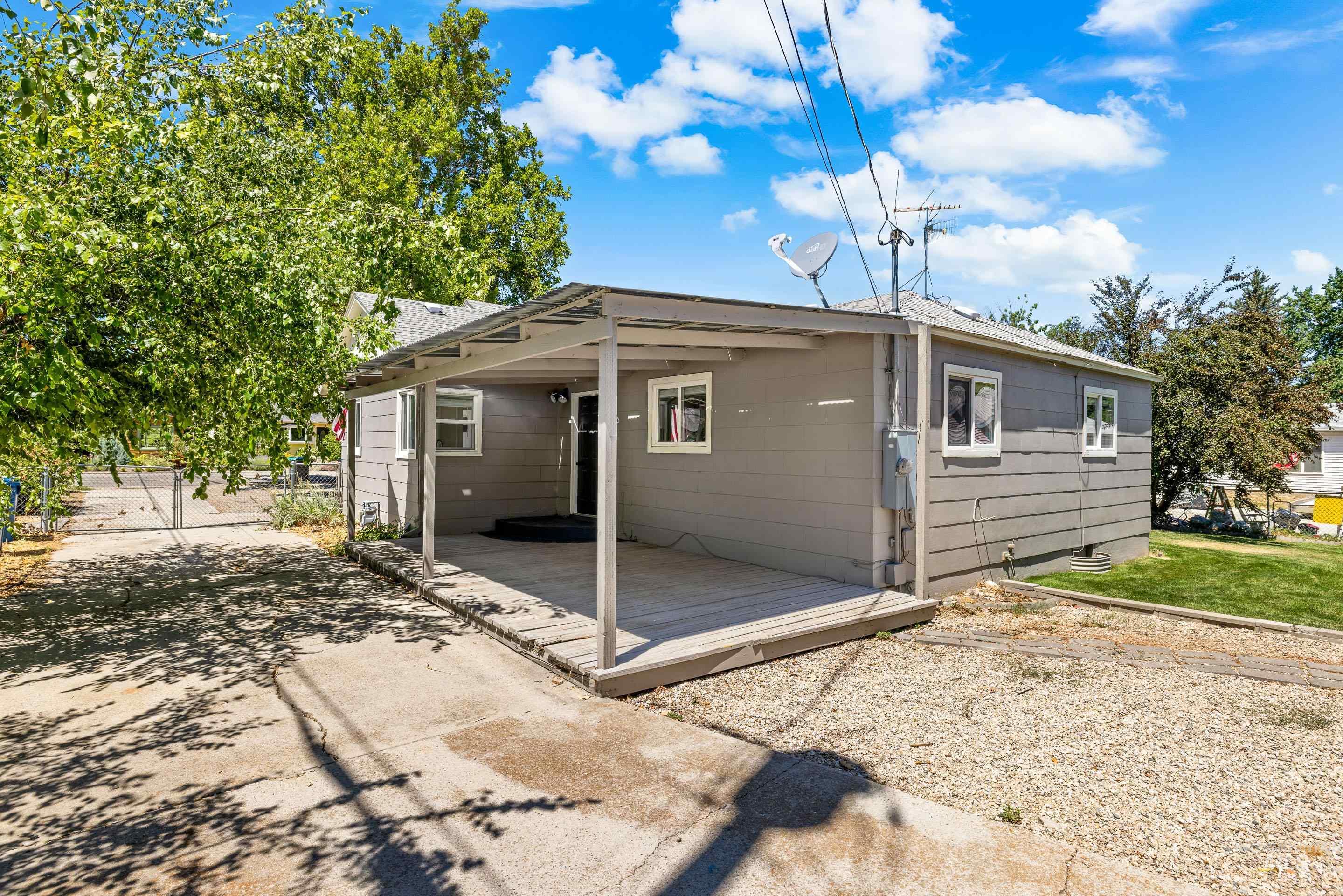 Rear view of property with a wooden deck