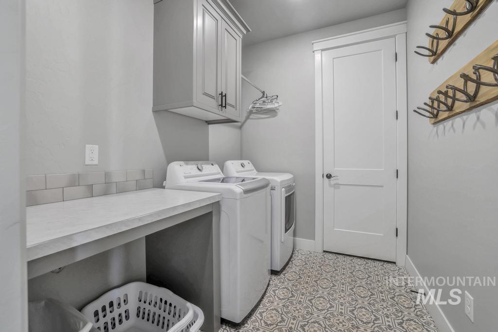 Laundry room with washer and dryer and cabinet space