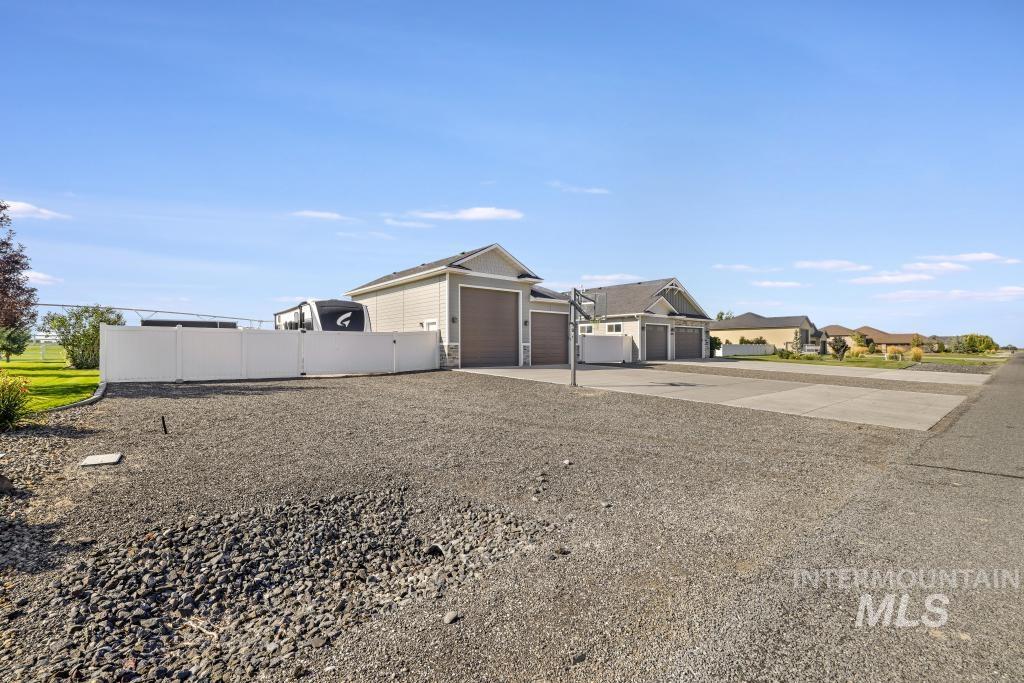 View of front of house featuring driveway and a garage