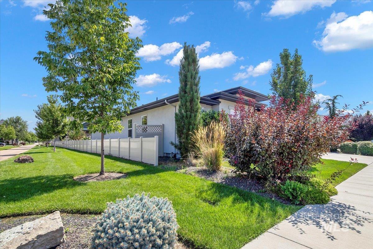 View of side of property featuring stucco siding