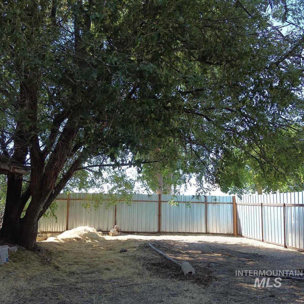 View of fenced backyard