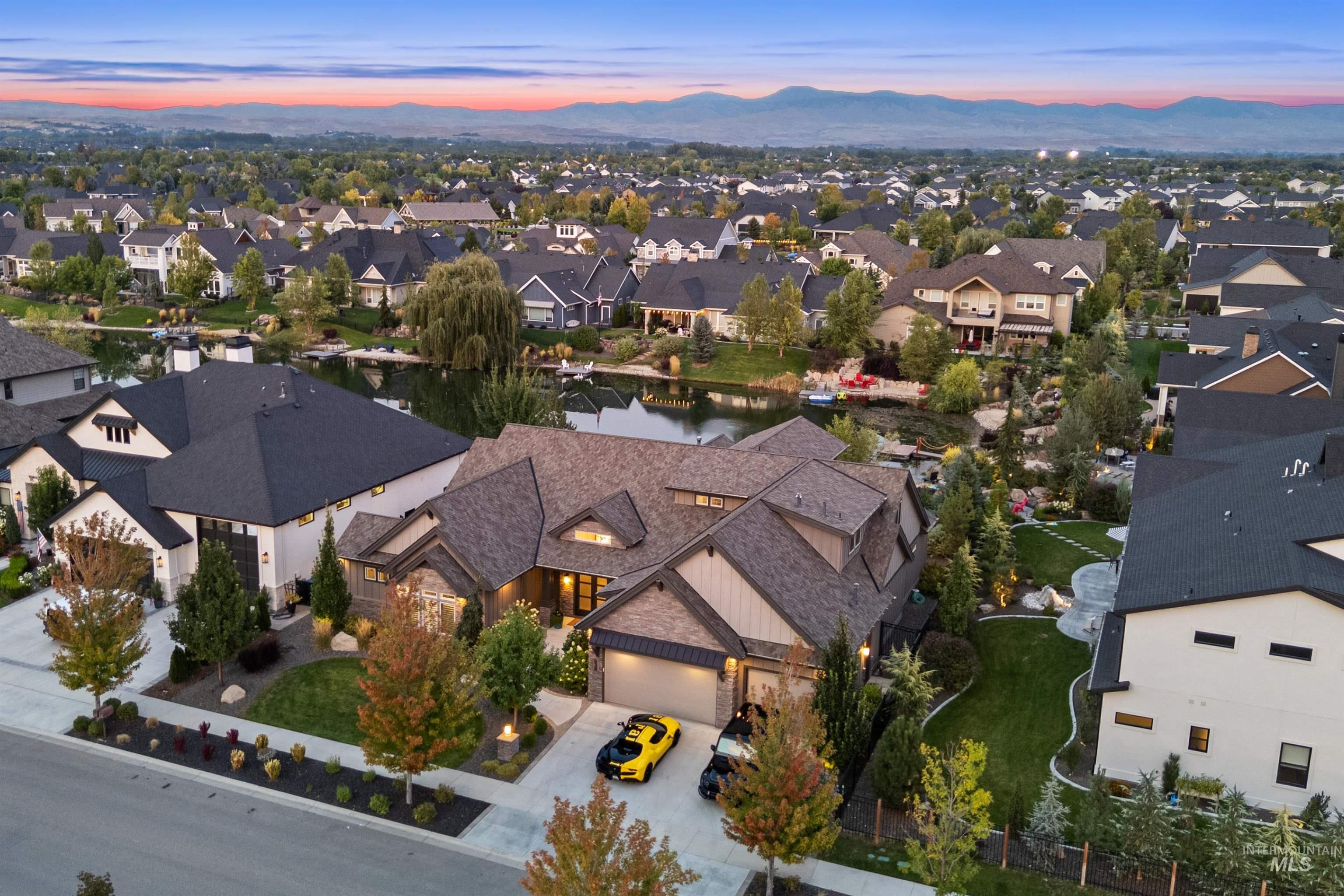 Aerial overview of property's location with a large body of water and nearby suburban area