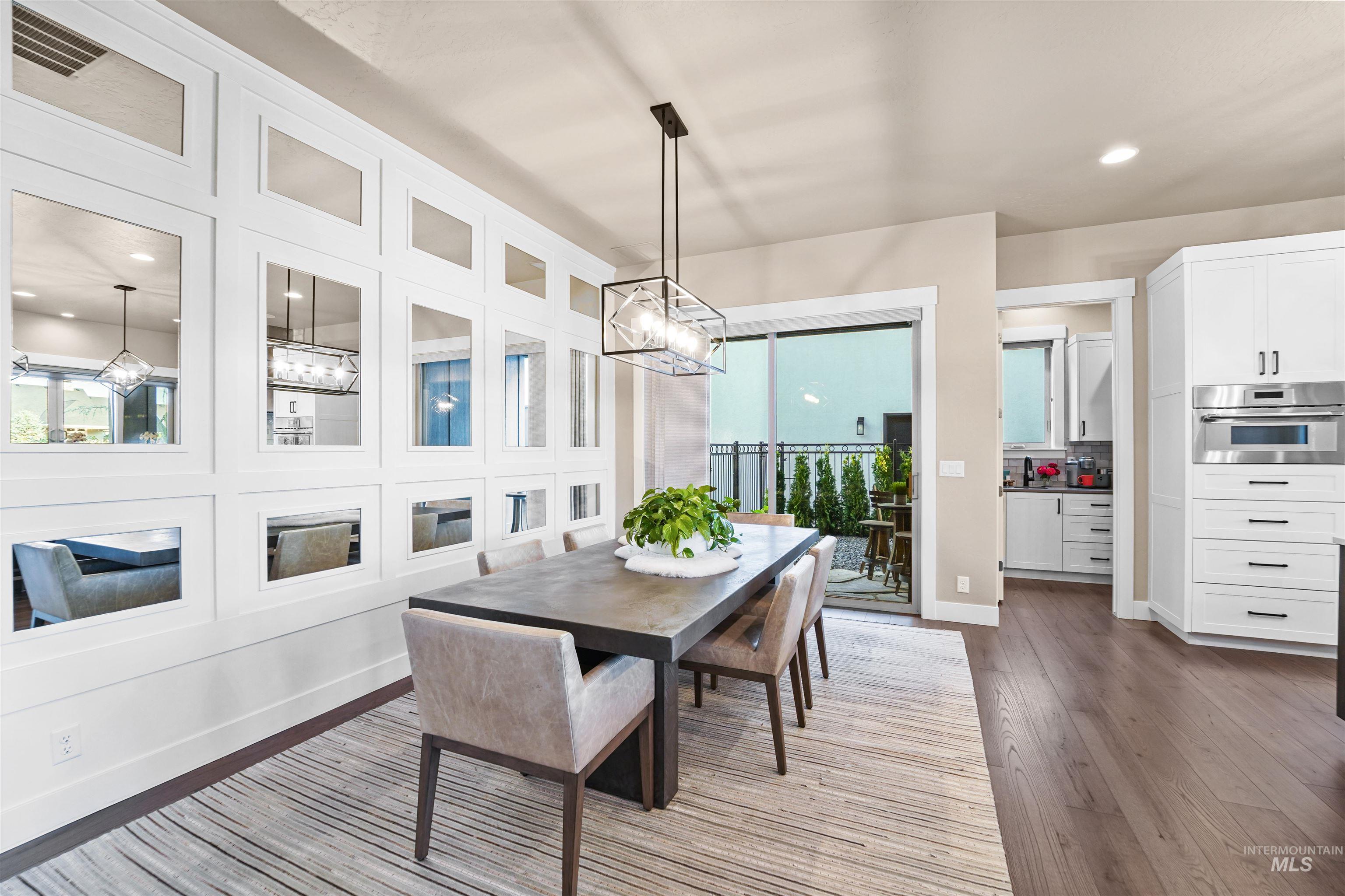 Dining space with recessed lighting, light wood-type flooring, and a chandelier