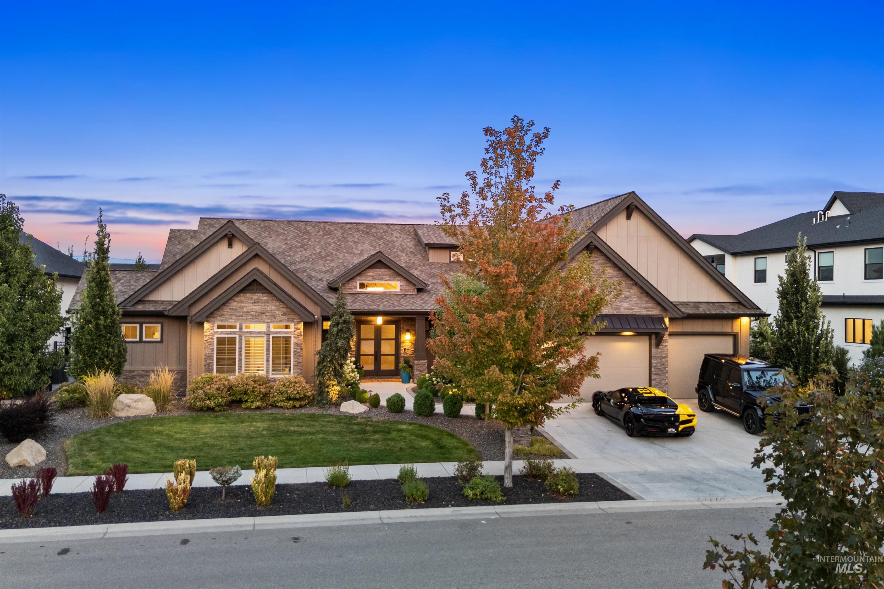 Craftsman inspired home featuring a front lawn, concrete driveway, a garage, stone siding, and a shingled roof