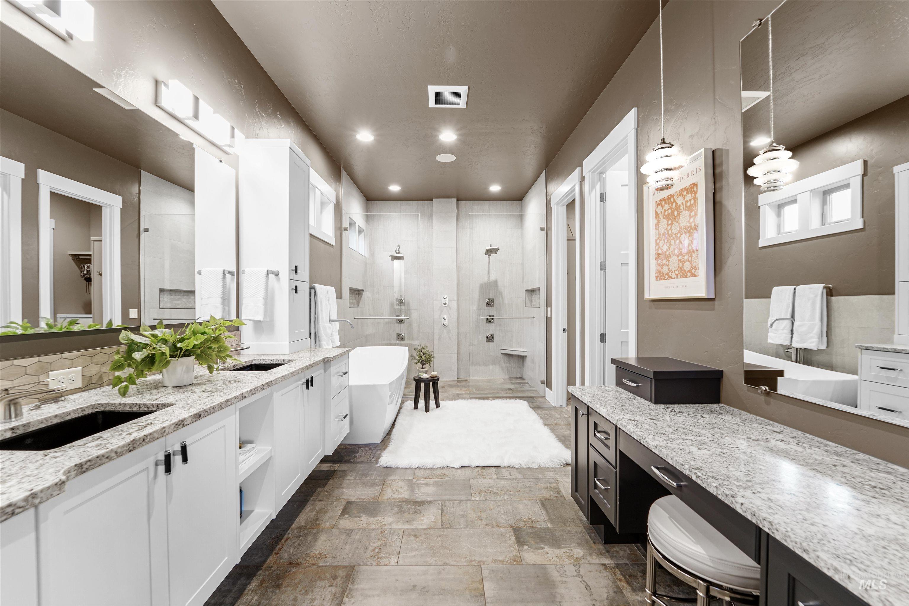 Full bath with a tile shower, vanity, a freestanding bath, backsplash, and recessed lighting