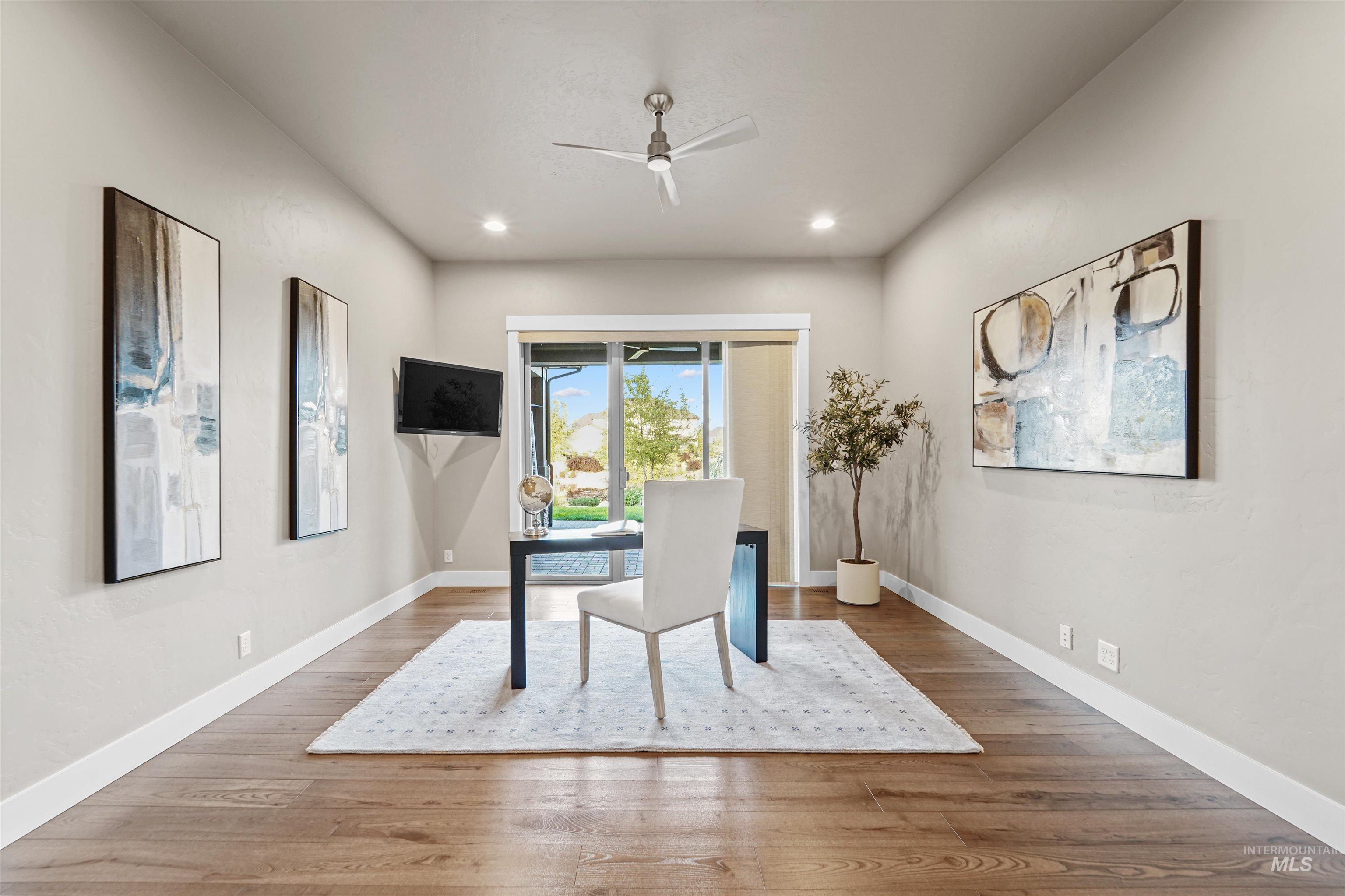 Office area with wood finished floors, ceiling fan, and recessed lighting