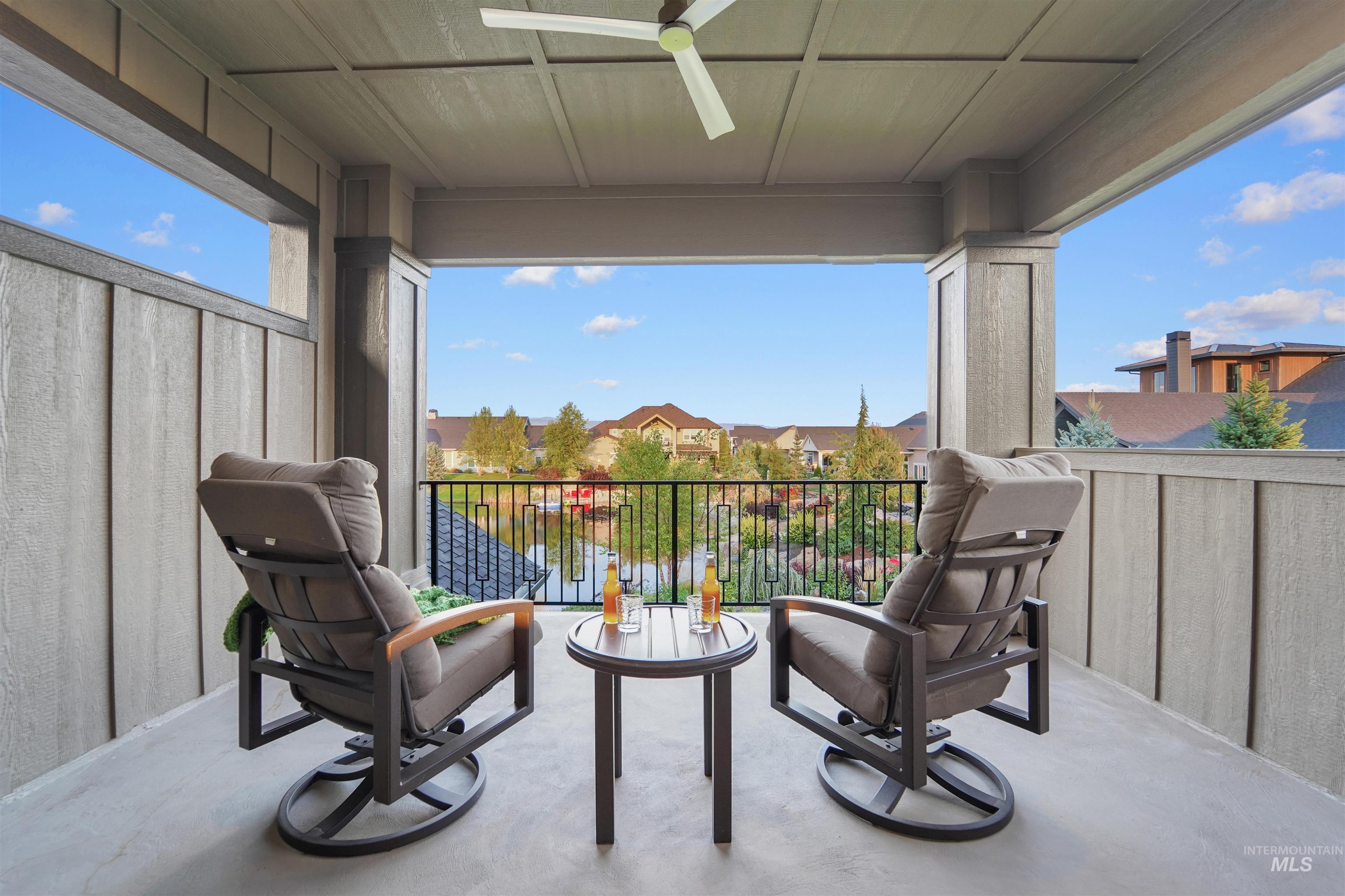 Balcony featuring a water view and a residential view