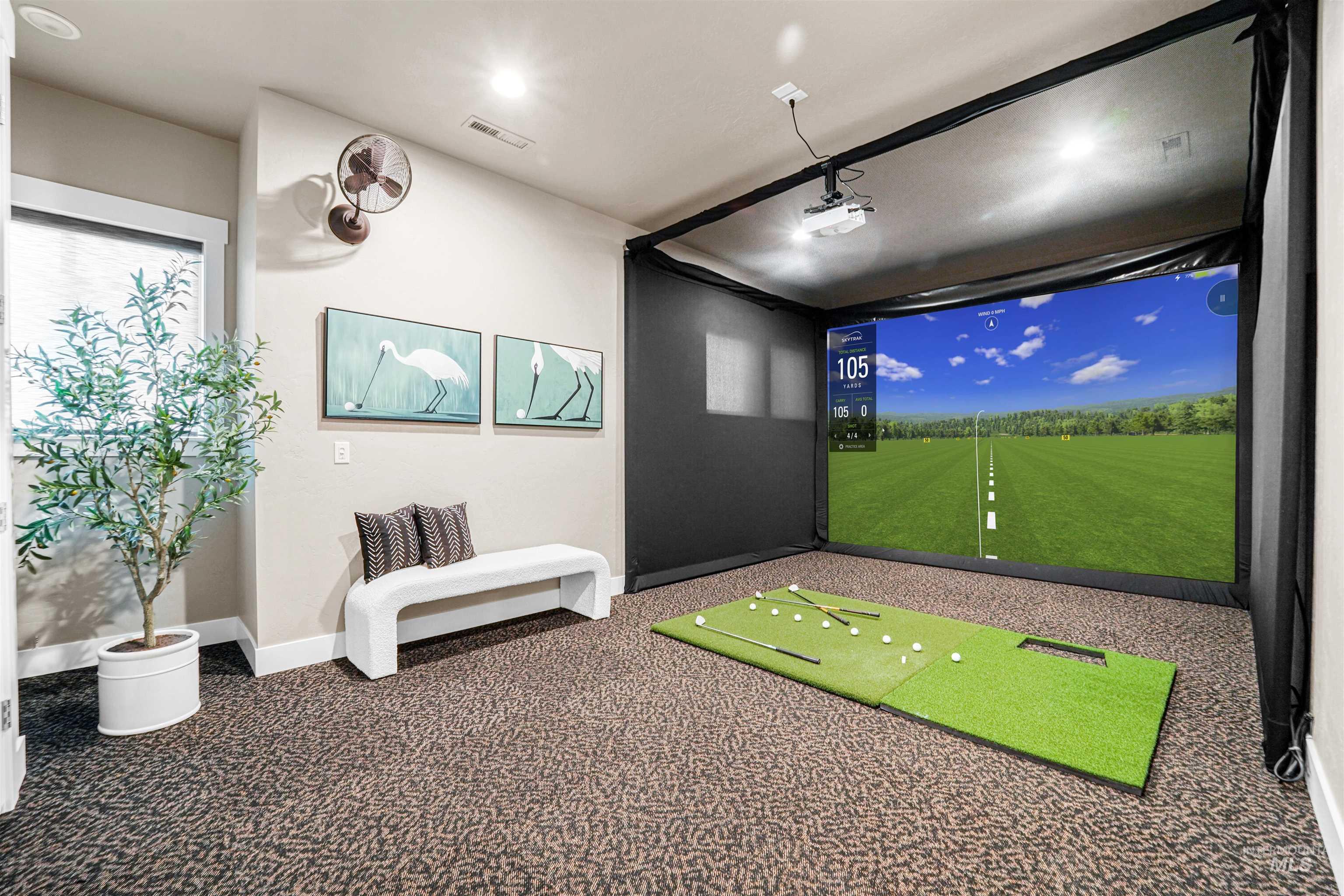 Rec room featuring golf simulator and carpet