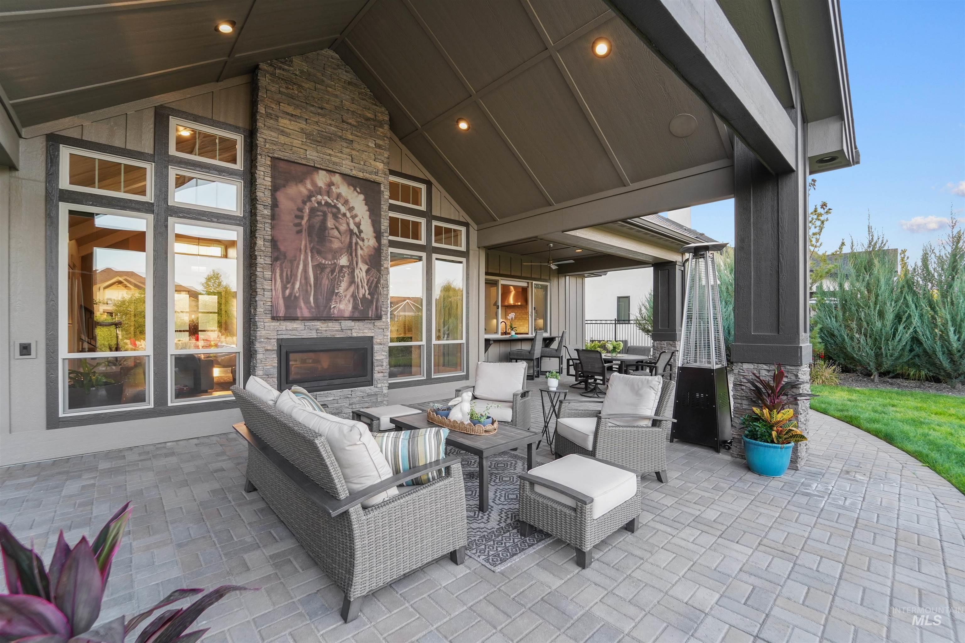 View of patio / terrace with an outdoor living space with a fireplace