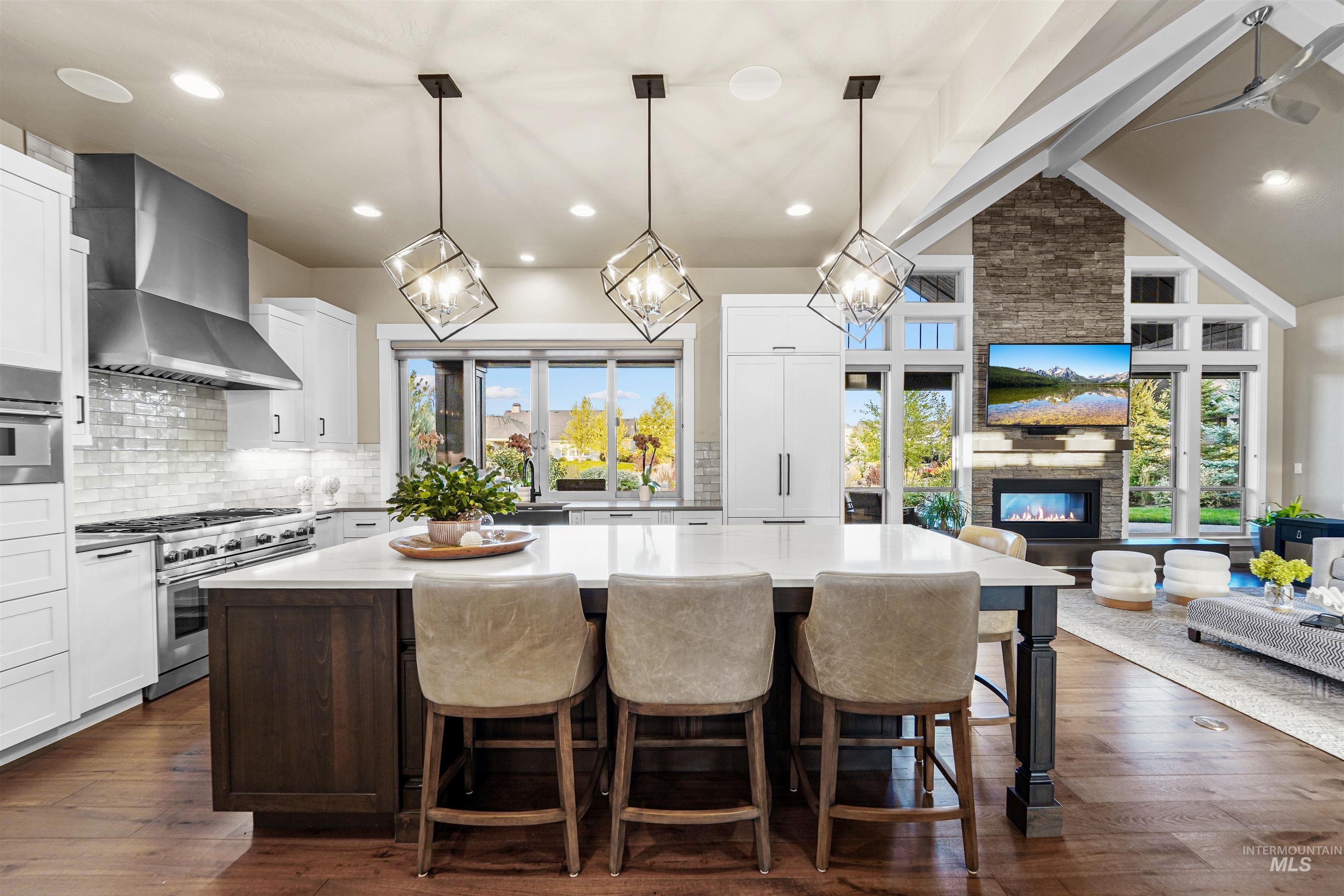 Kitchen featuring plenty of natural light, backsplash, hanging light fixtures, appliances with stainless steel finishes, and recessed lighting