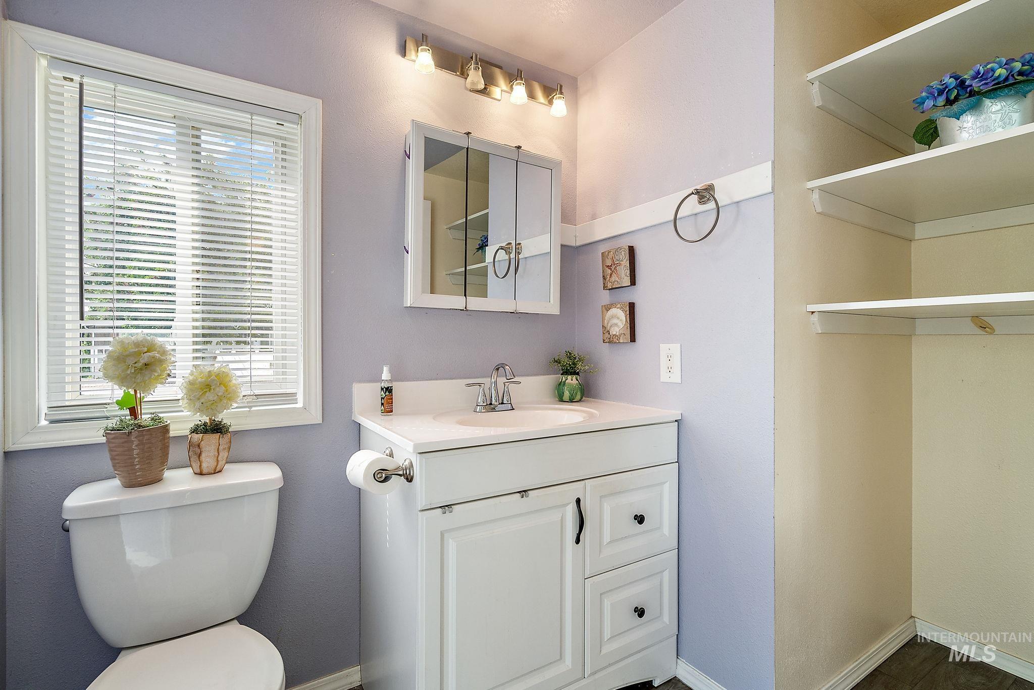 Master bathroom featuring toilet and vanity