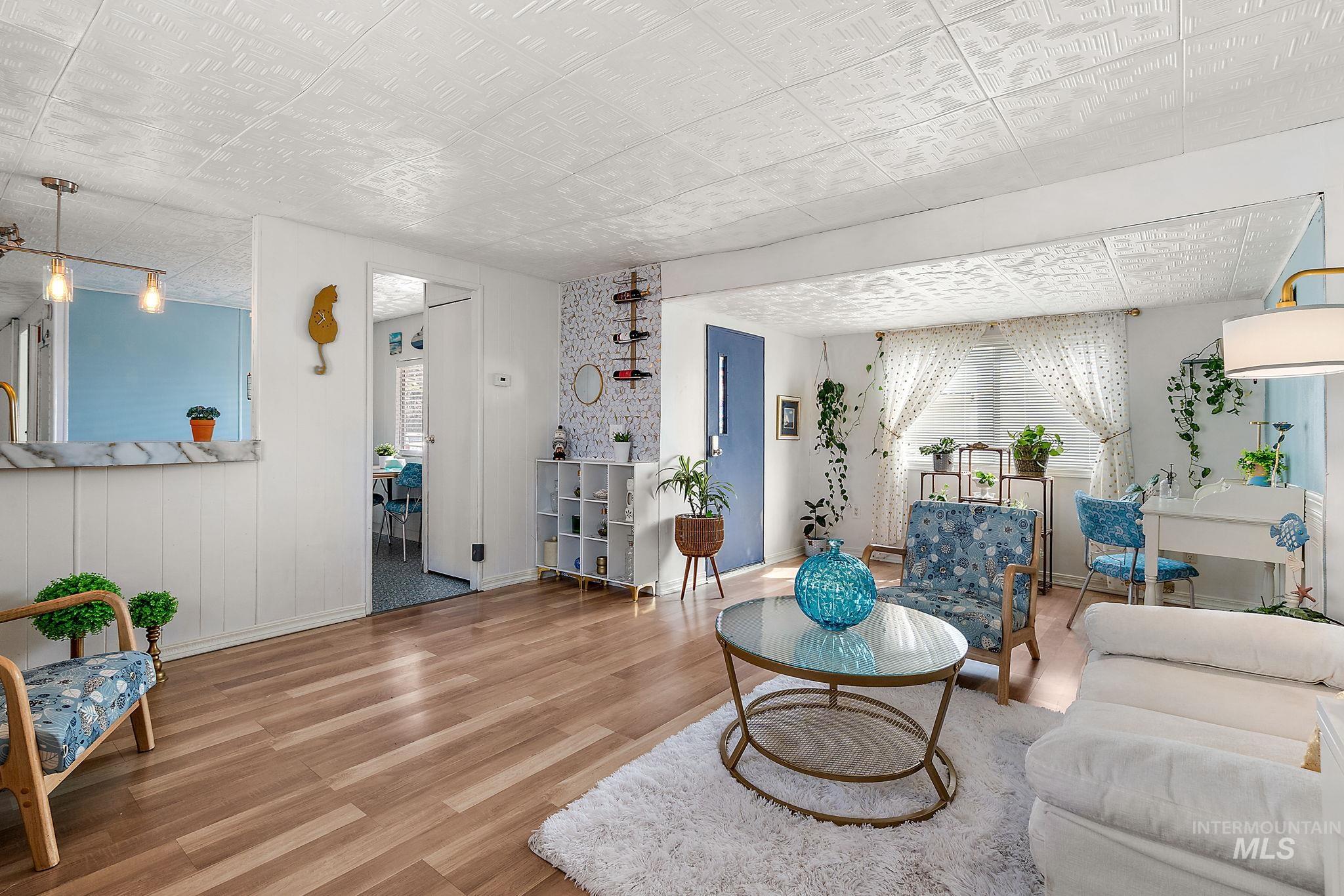 Living area featuring wood finished floors and baseboards