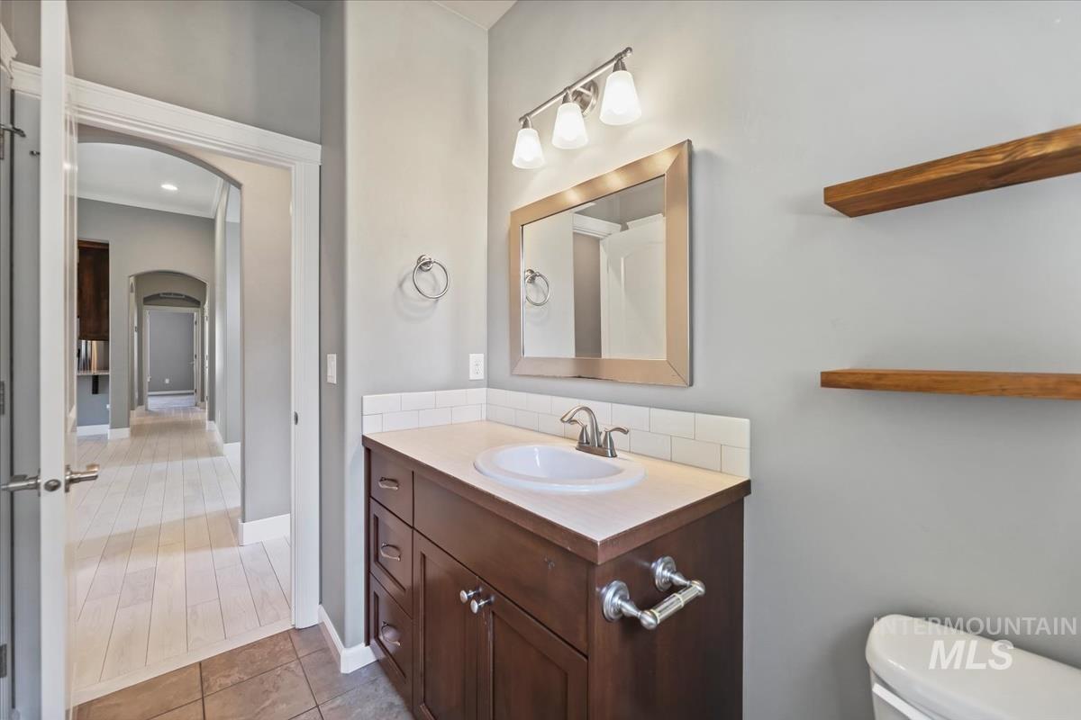 Bathroom with vanity and light tile patterned flooring