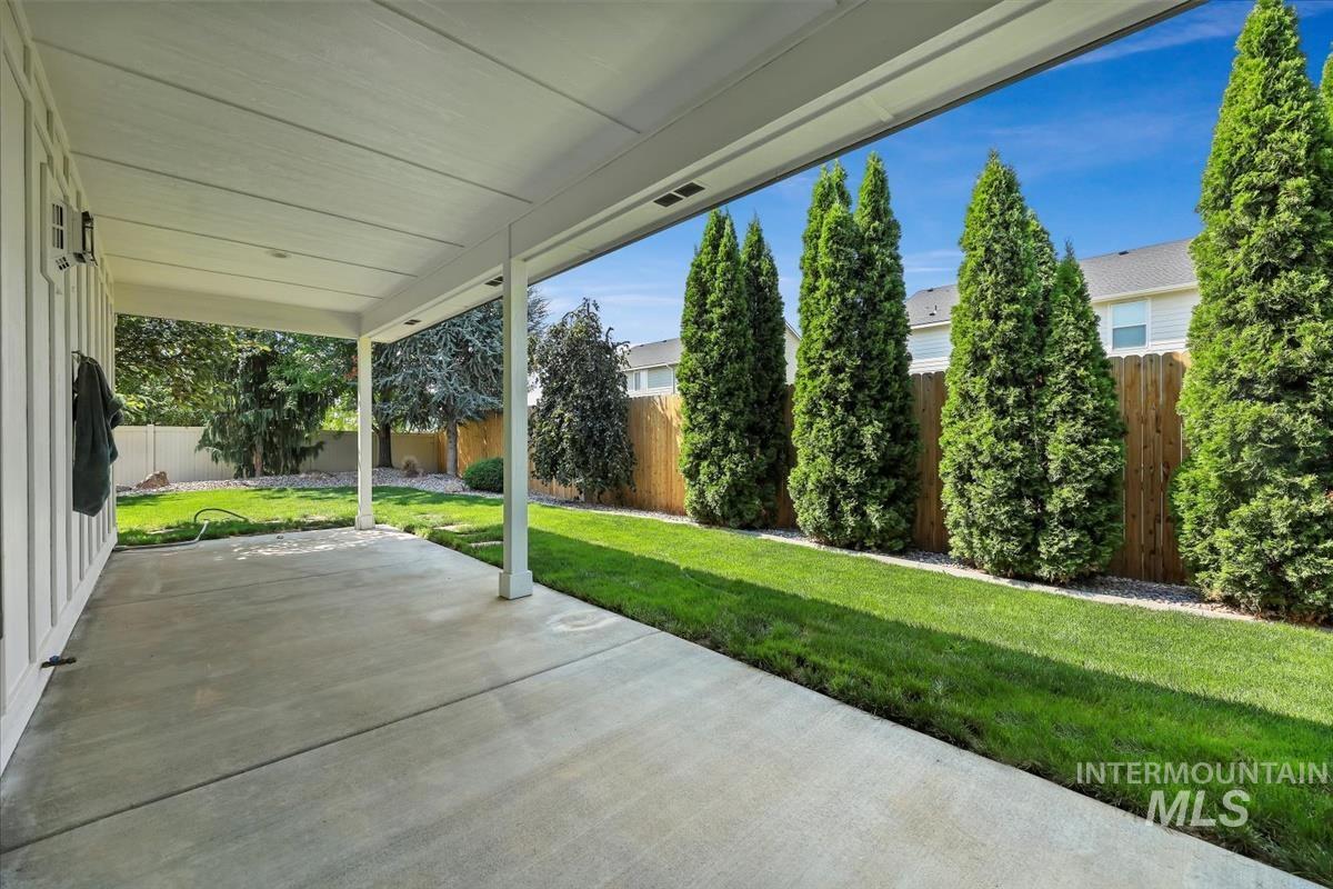 Fenced backyard with a patio area
