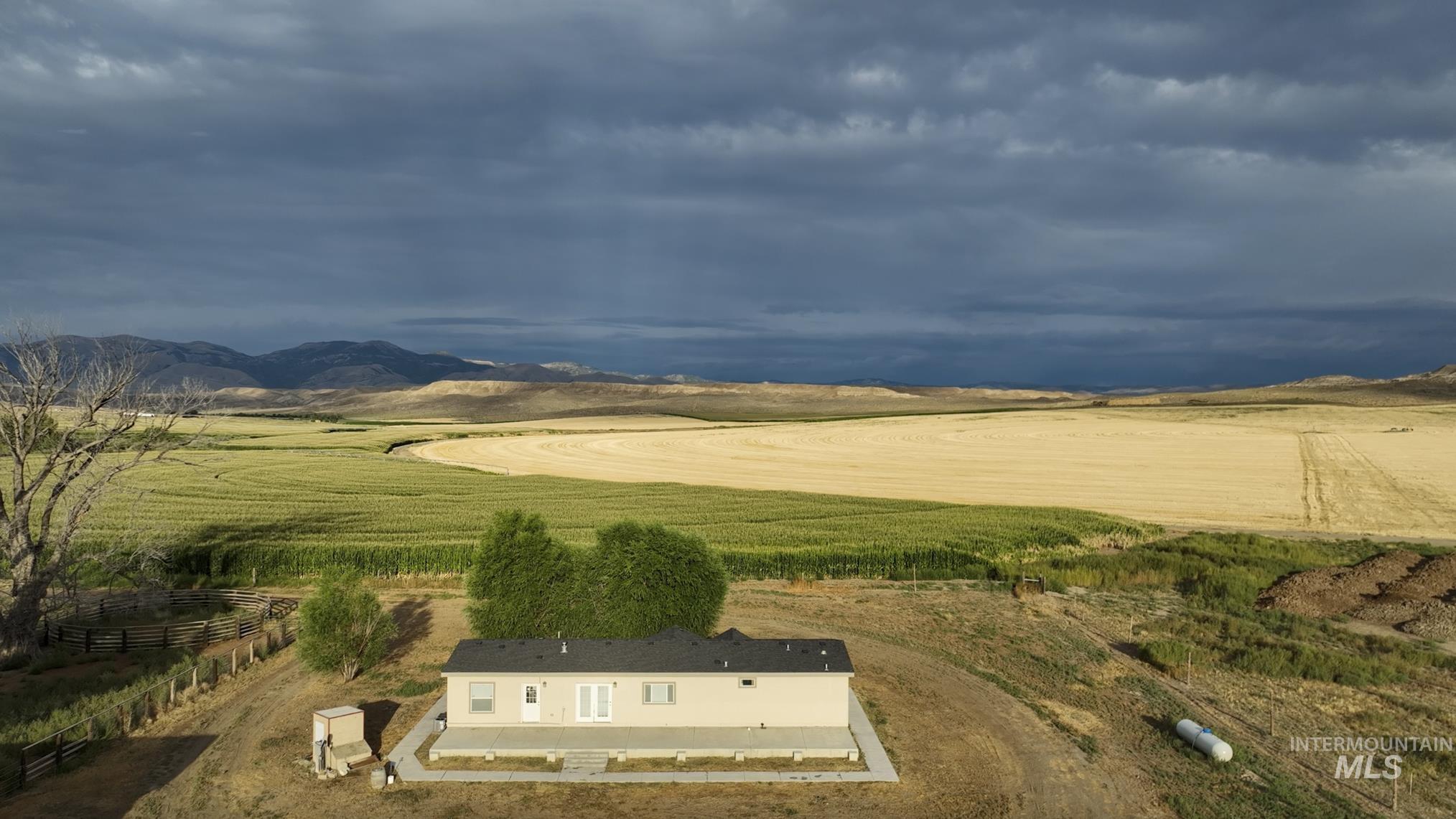 Surrounding community with a view of rural / pastoral area and a patio area