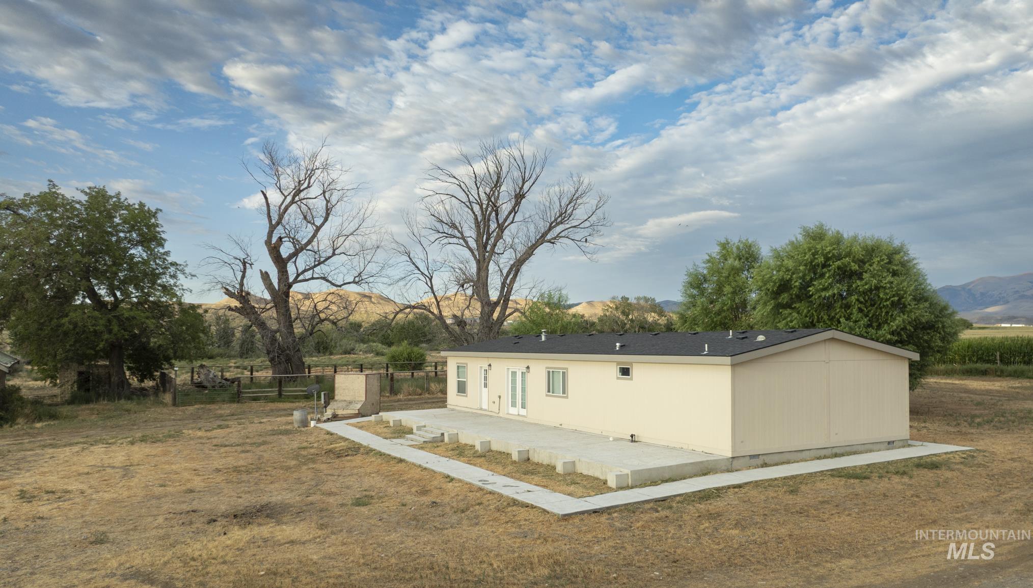 View of outbuilding with a mountain view and a rural view