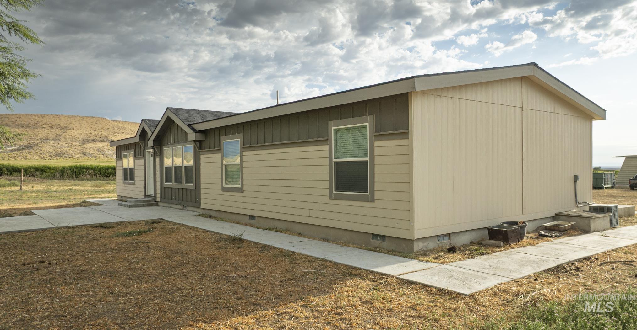 View of side of home featuring crawl space