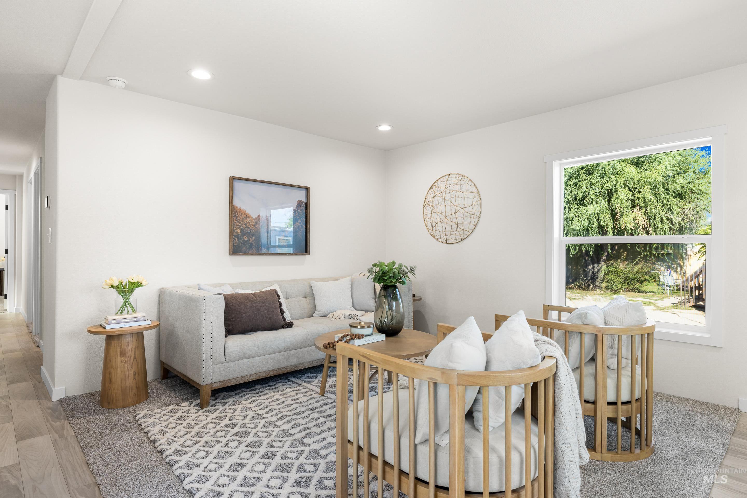 Living room featuring light wood-style floors and recessed lighting