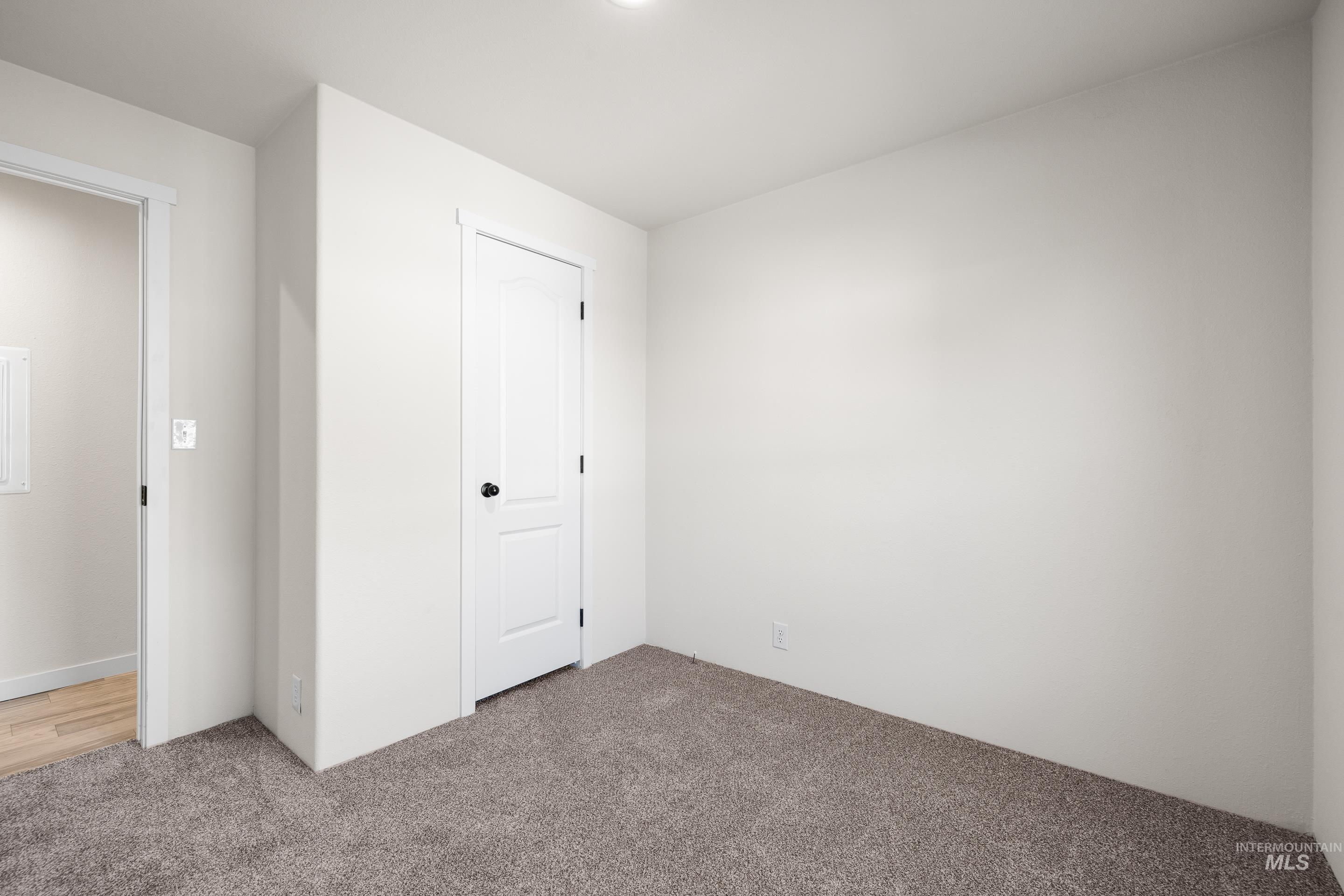 Unfurnished bedroom featuring carpet floors and a closet
