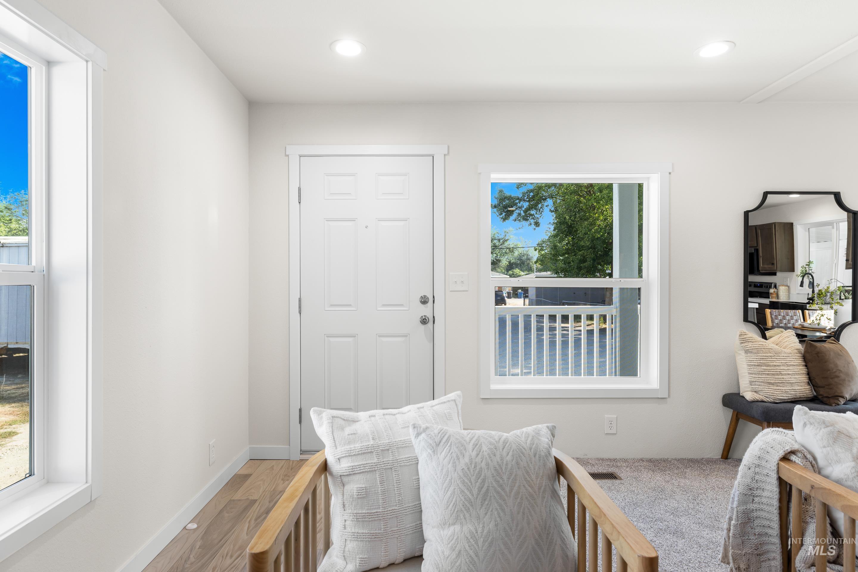 Interior space with recessed lighting and wood finished floors