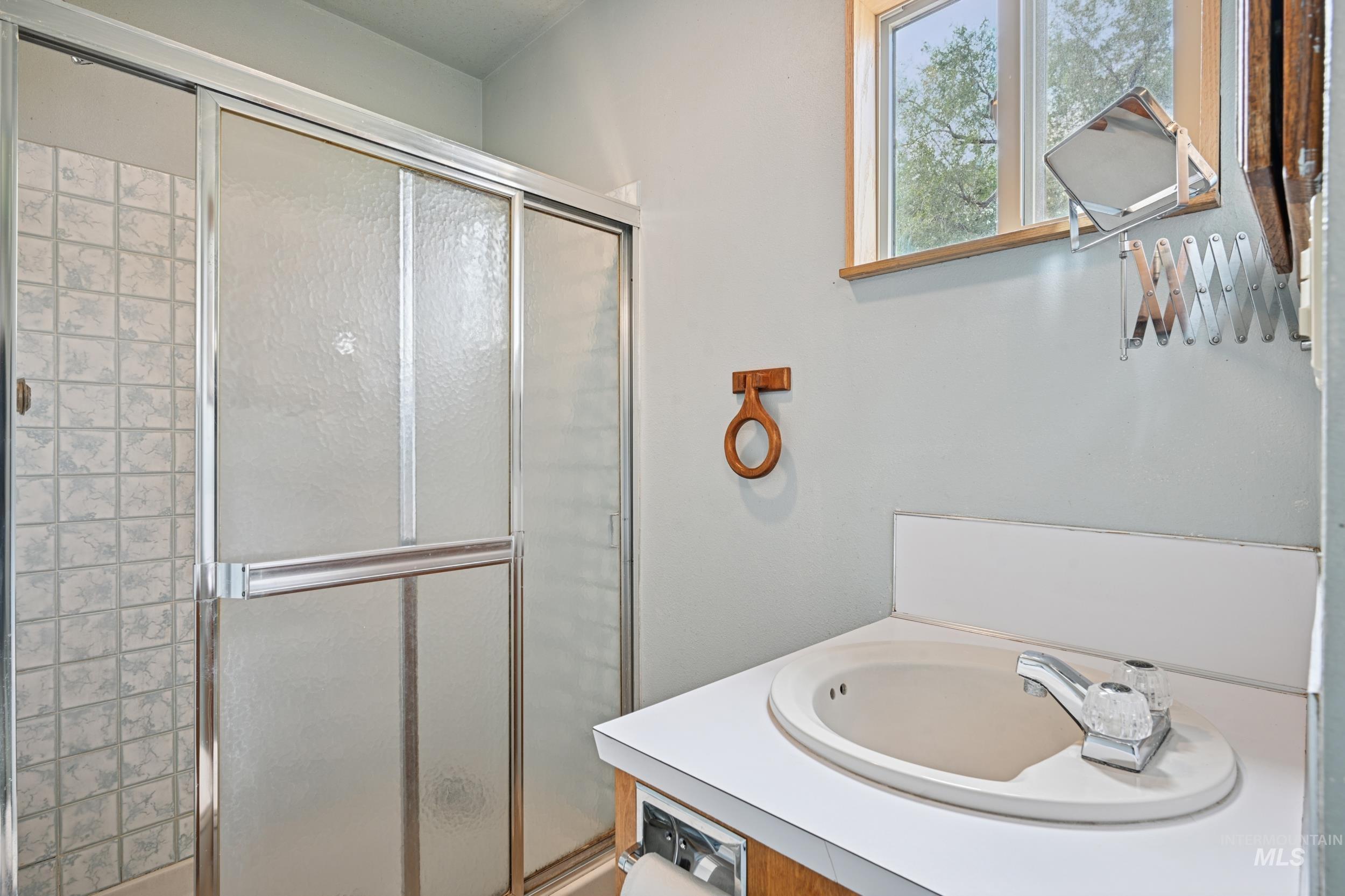 Full bathroom with a shower stall and a garden tub