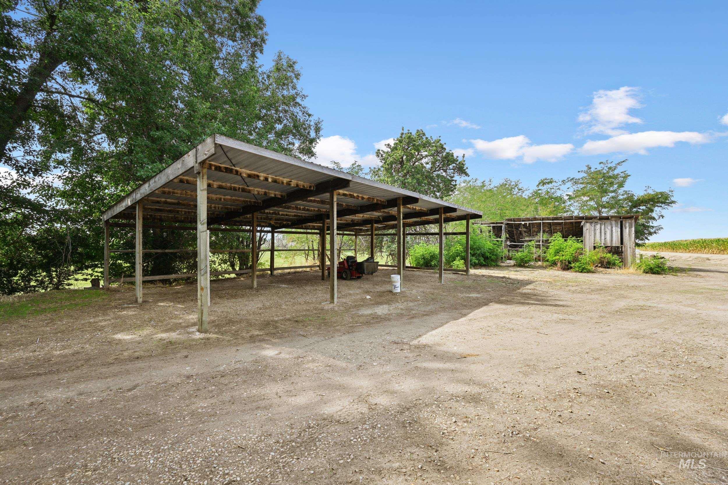 View of vehicle parking with a carport