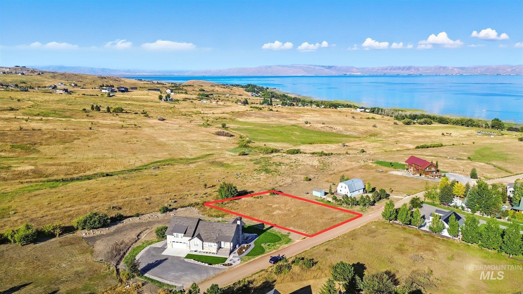 View of property location featuring property parcel outlined and a large body of water