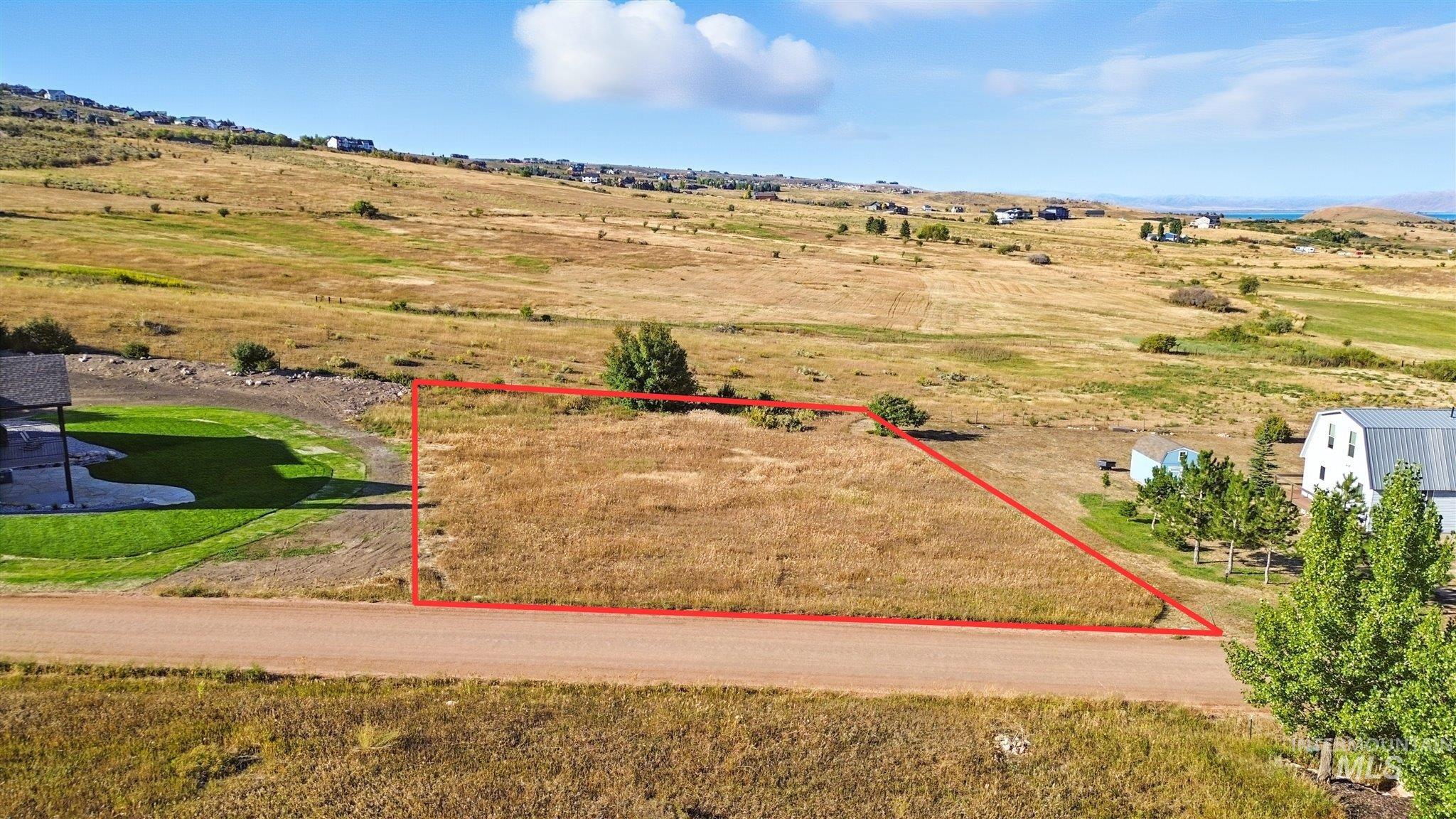 Aerial view of sparsely populated area with property boundaries highlighted