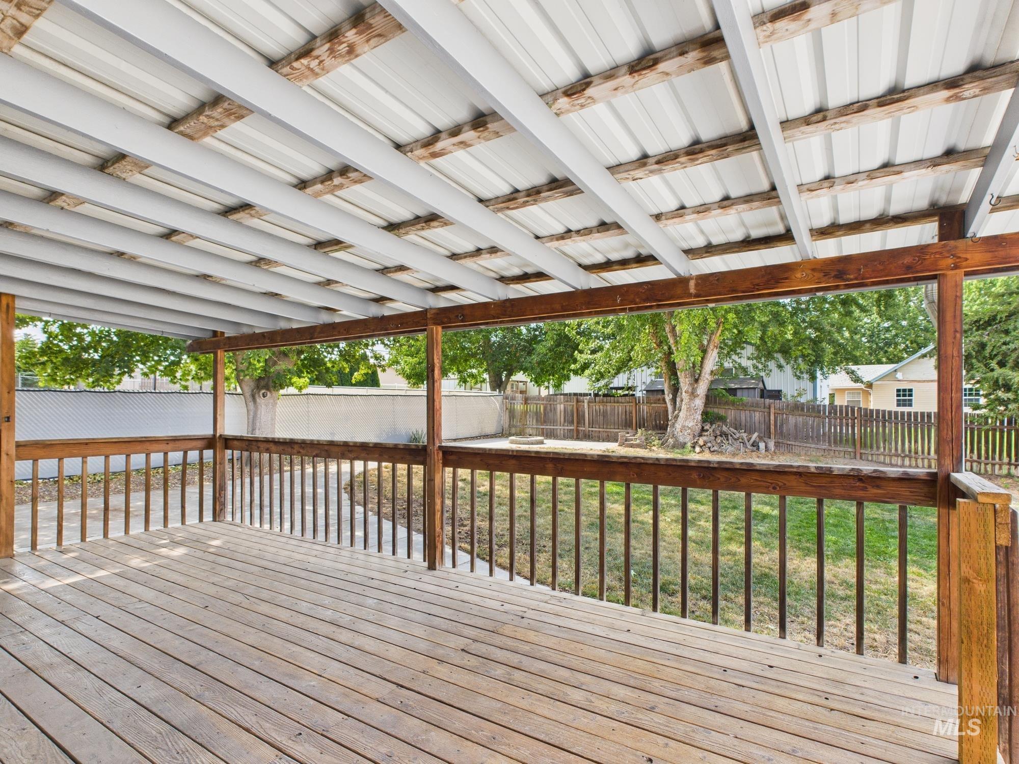 Deck with a fenced backyard