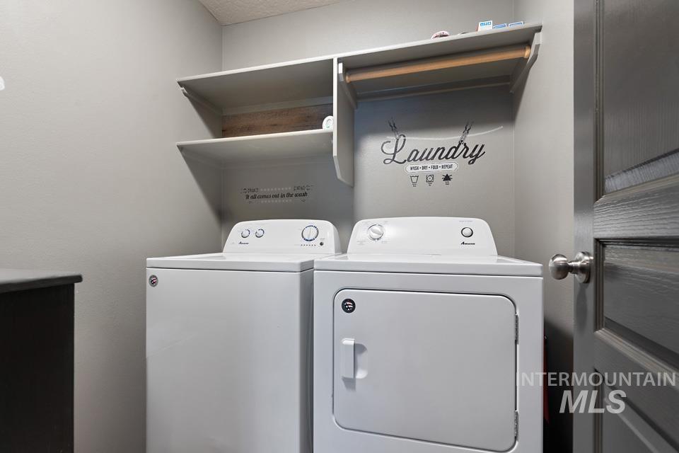 Laundry area featuring independent washer and dryer
