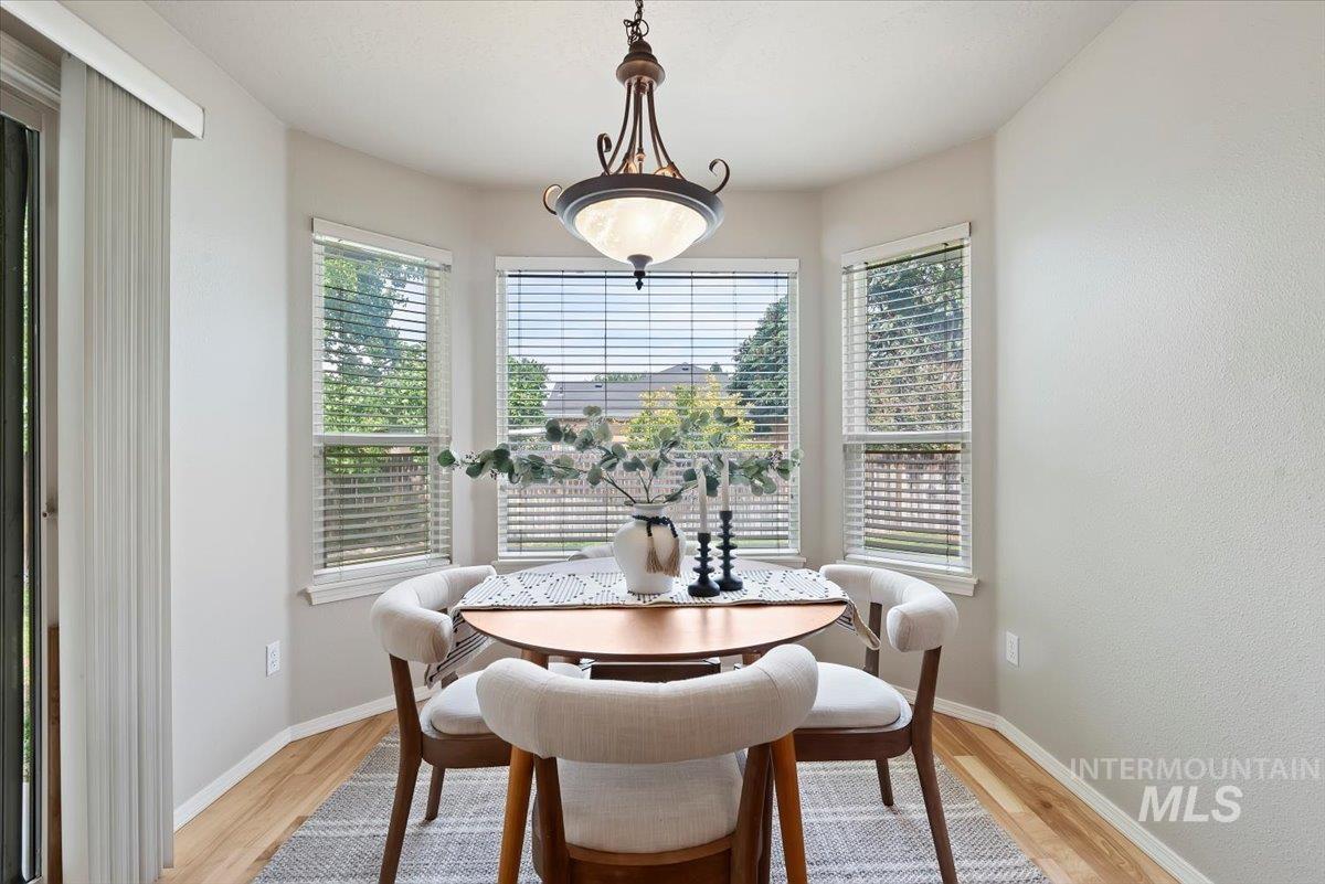Dining room featuring light wood-style flooring and plenty of natural light