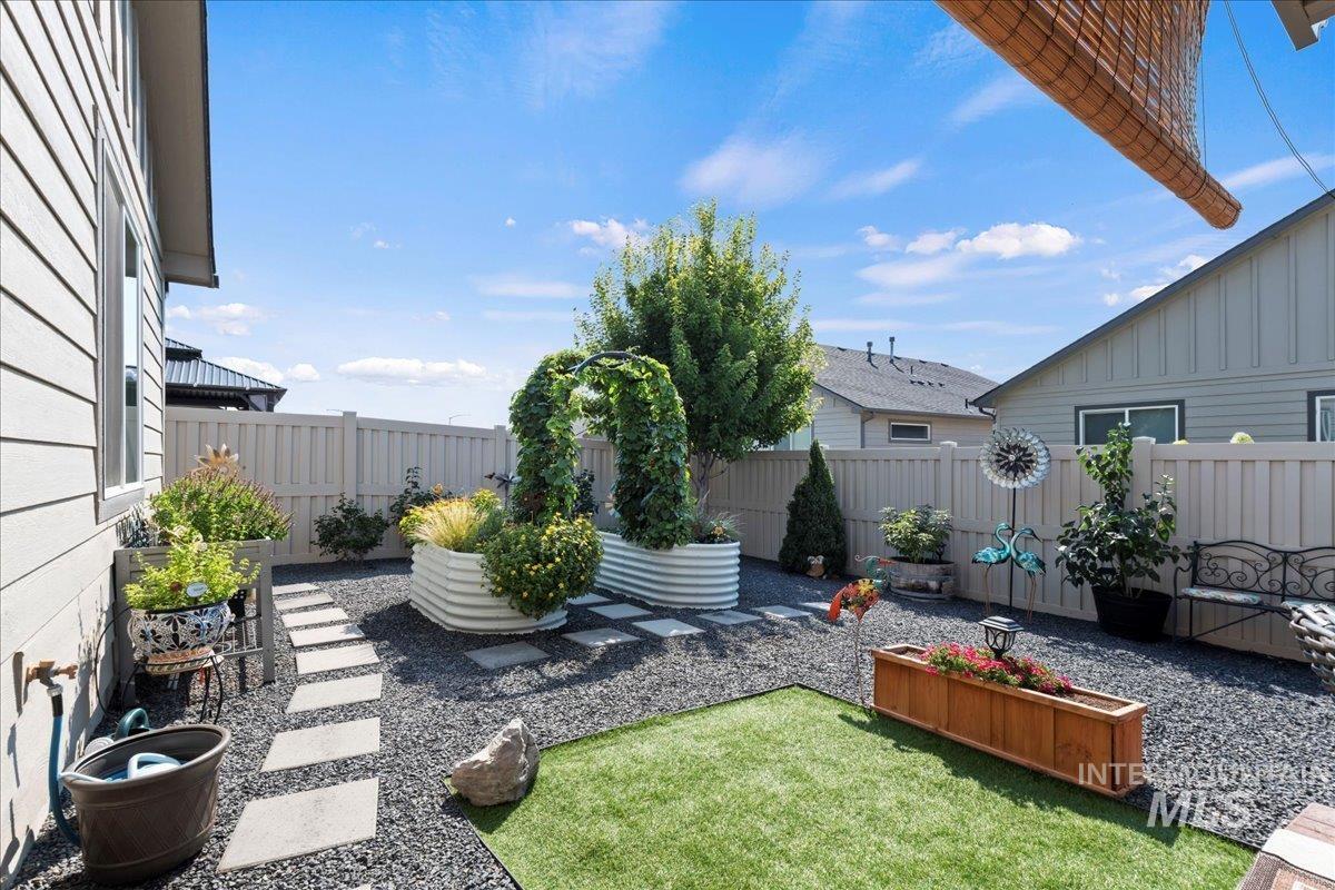 Fenced backyard with a patio