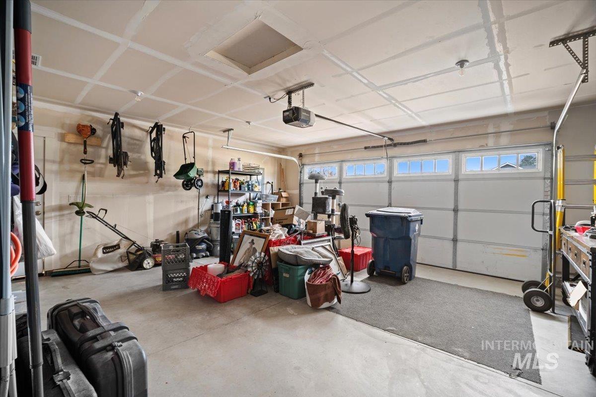 Garage featuring a garage door opener