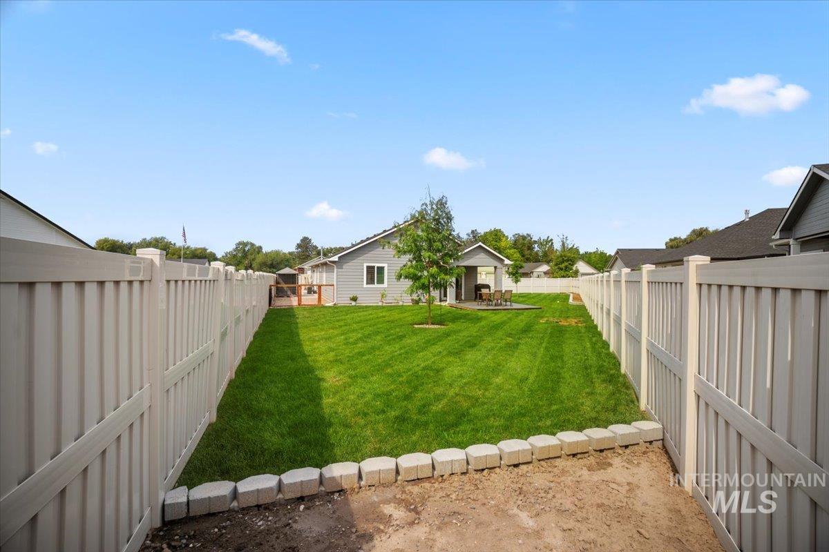 Fenced backyard featuring a patio area