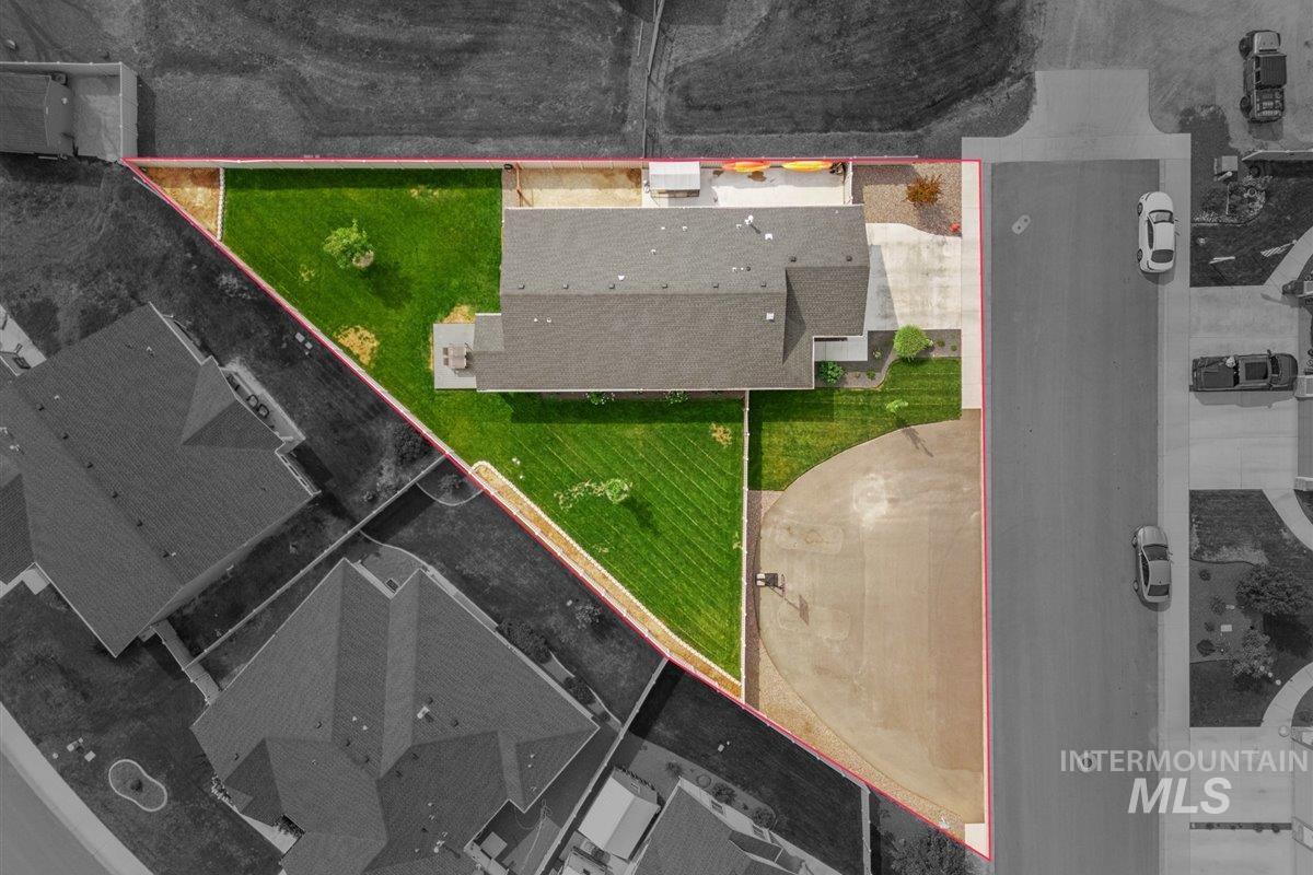Aerial view of property and surrounding area featuring property boundaries highlighted