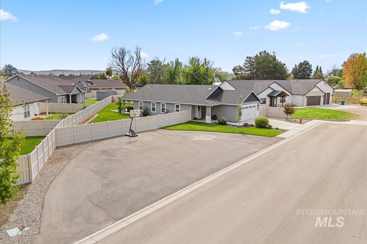 View of front of home featuring a residential view and driveway