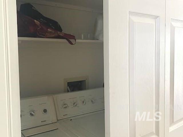 Washroom featuring washer and dryer