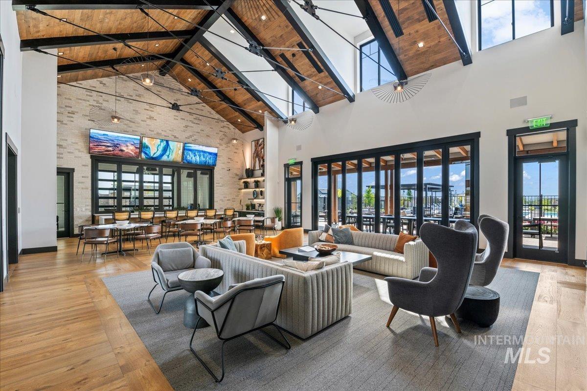 Common area featuring high vaulted ceiling and a wood ceiling with exposed beams