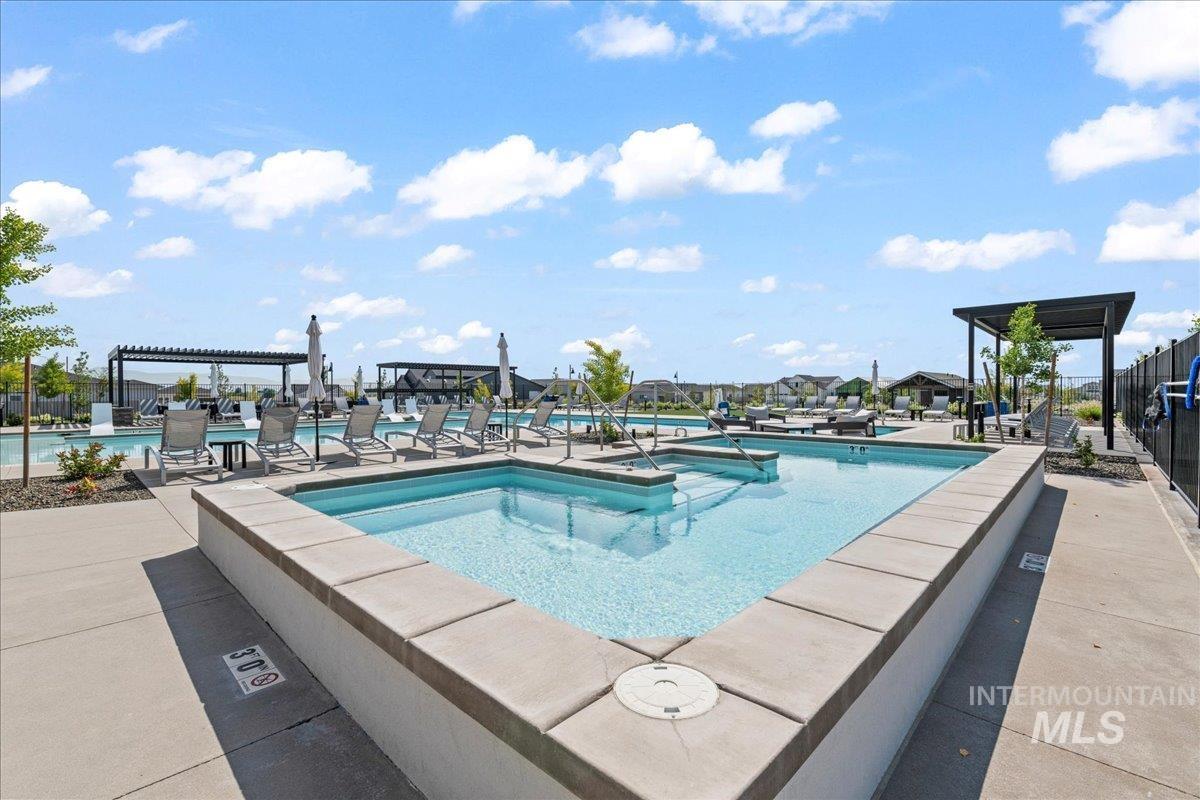 Community pool featuring a patio area